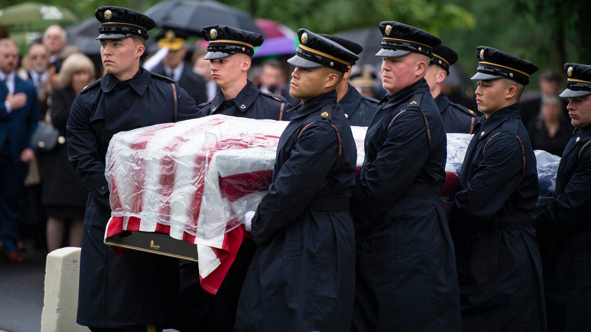 soldiers holding a casket