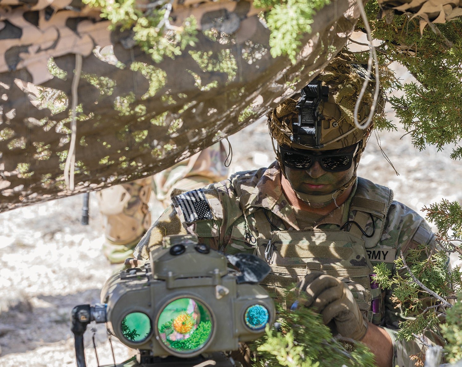 Sgt. Andrew Polich, of the 2nd Stryker Brigade Combat Team, 4th Infantry Division, uses a Lightweight Laser Designator Rangefinder at his observation post during the division’s Ivy Mass exercise at Fort Carson, Colorado. (Credit: U.S. Army/U.S. Army/Sgt. Woodlyne Escarne)