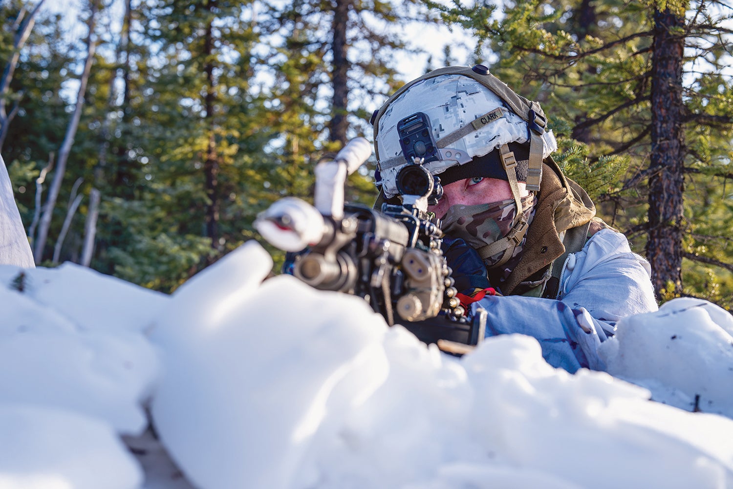 A soldier with the 2nd Infantry Brigade Combat Team (Airborne), 11th Airborne Division, takes aim during training at Donnelly Training Area, Alaska. (Credit: U.S. Army/Pfc. Mike Godinez-Martinez)