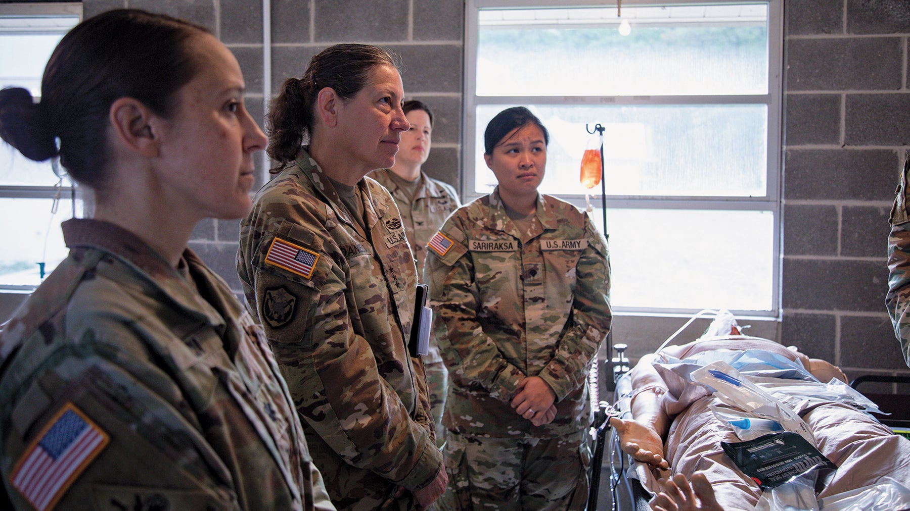 Lt. Gen. Jody Daniels, second from left, U.S. Army Reserve chief and commanding general of the U.S. Army Reserve Command, visits soldiers participating in an exercise at Camp Grayling, Michigan. (Credit: U.S. Army/Maj. Xeriqua Garfinkel)