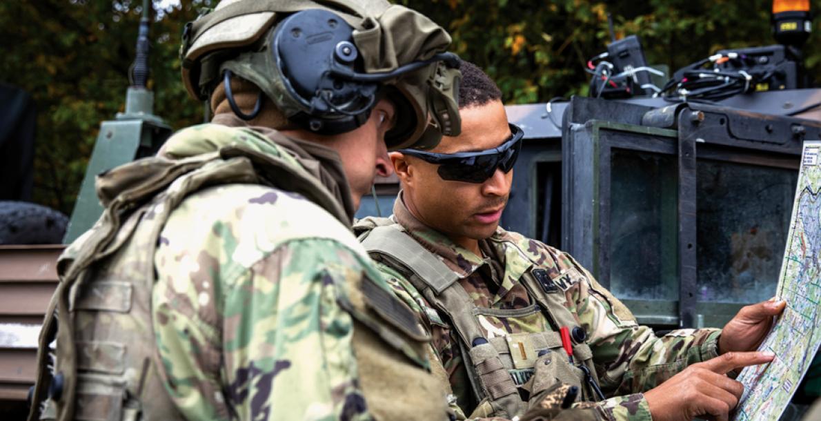 Sgt. Jaden Terry, left, and 2nd Lt. Miles Walker, of the 1st Battalion, 77th Field Artillery Regiment, 41st Field Artillery Brigade, consult a map during an exercise at the Joint Multinational Readiness Center, Germany.