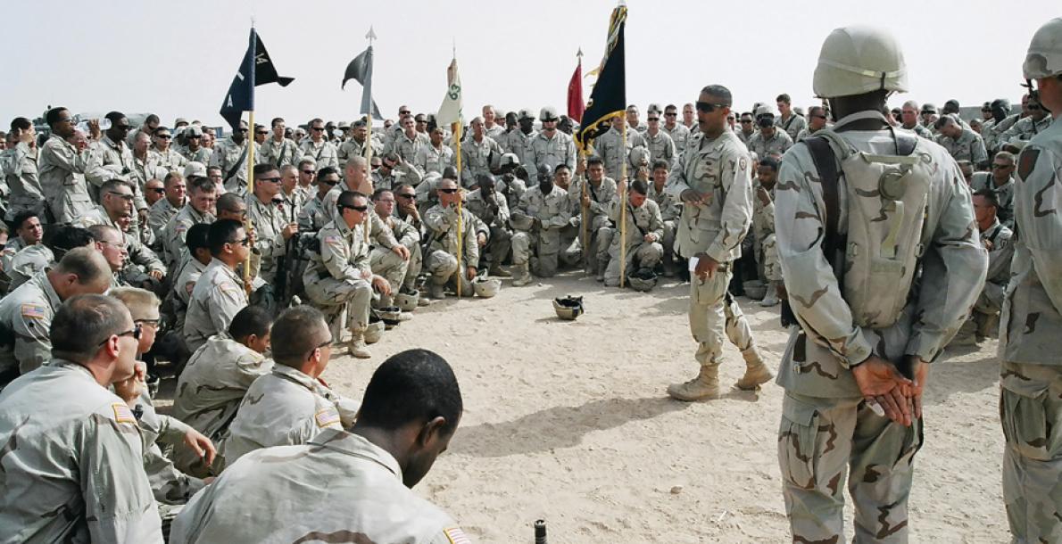 Then-Lt. Col. Dave Miller talks to soldiers from the 1st Battalion, 14th Infantry Regiment, at the end of their mission in Najaf, Iraq, in July 2004.
