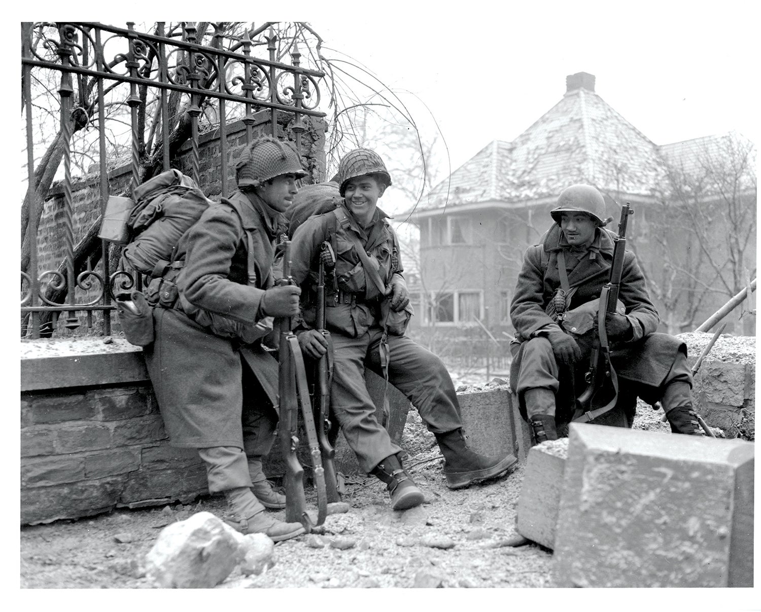 Soldiers take a break near Malmedy, Belgium. (Credit: National Archives)