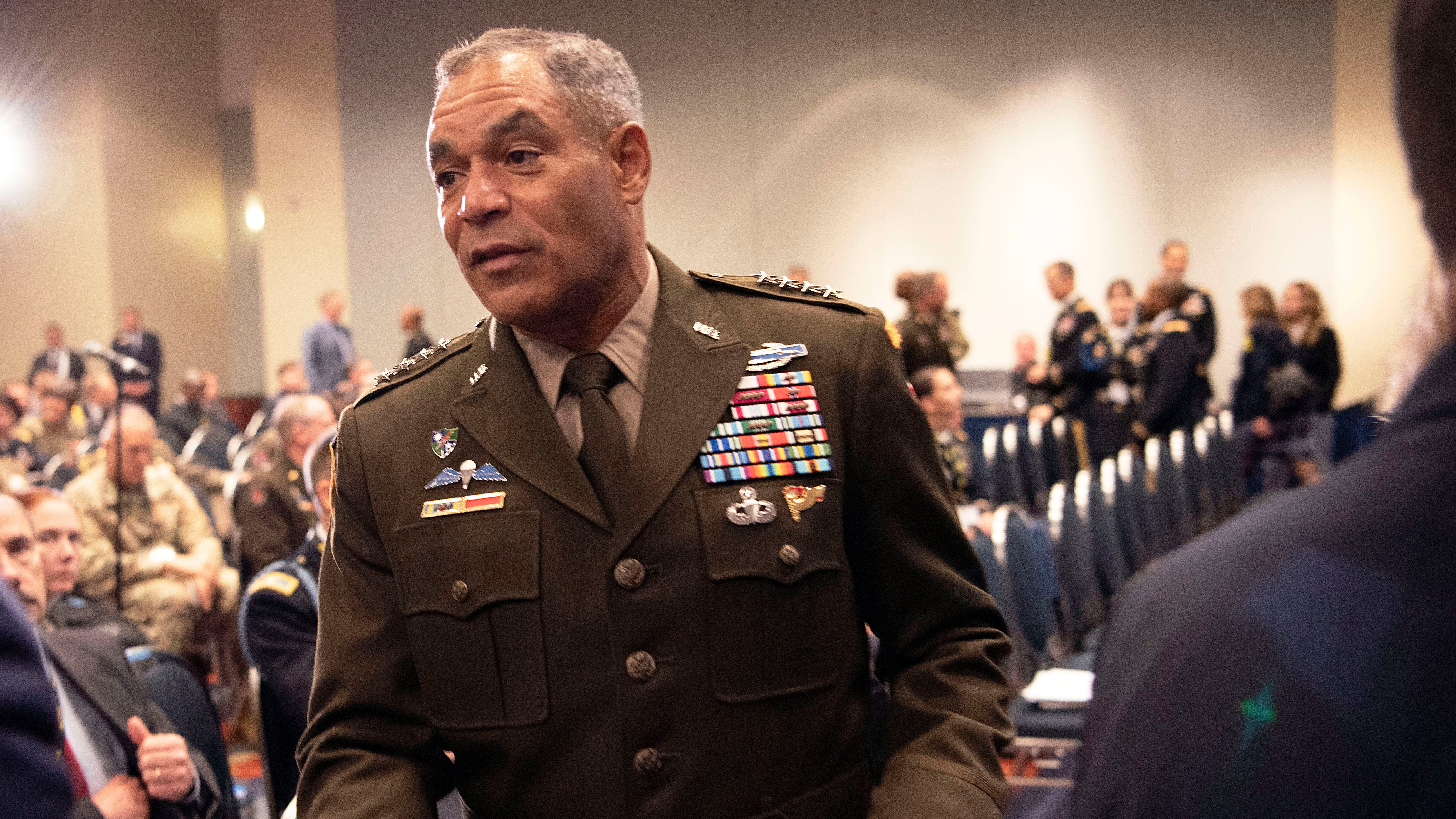 LTG Michael Garrett greets an attendee at the ILW Forum Readiness panel discussion at the 2019 AUSA Annual Meeting and Exposition at the Washington Convention Center on Oct. 14, 2019.