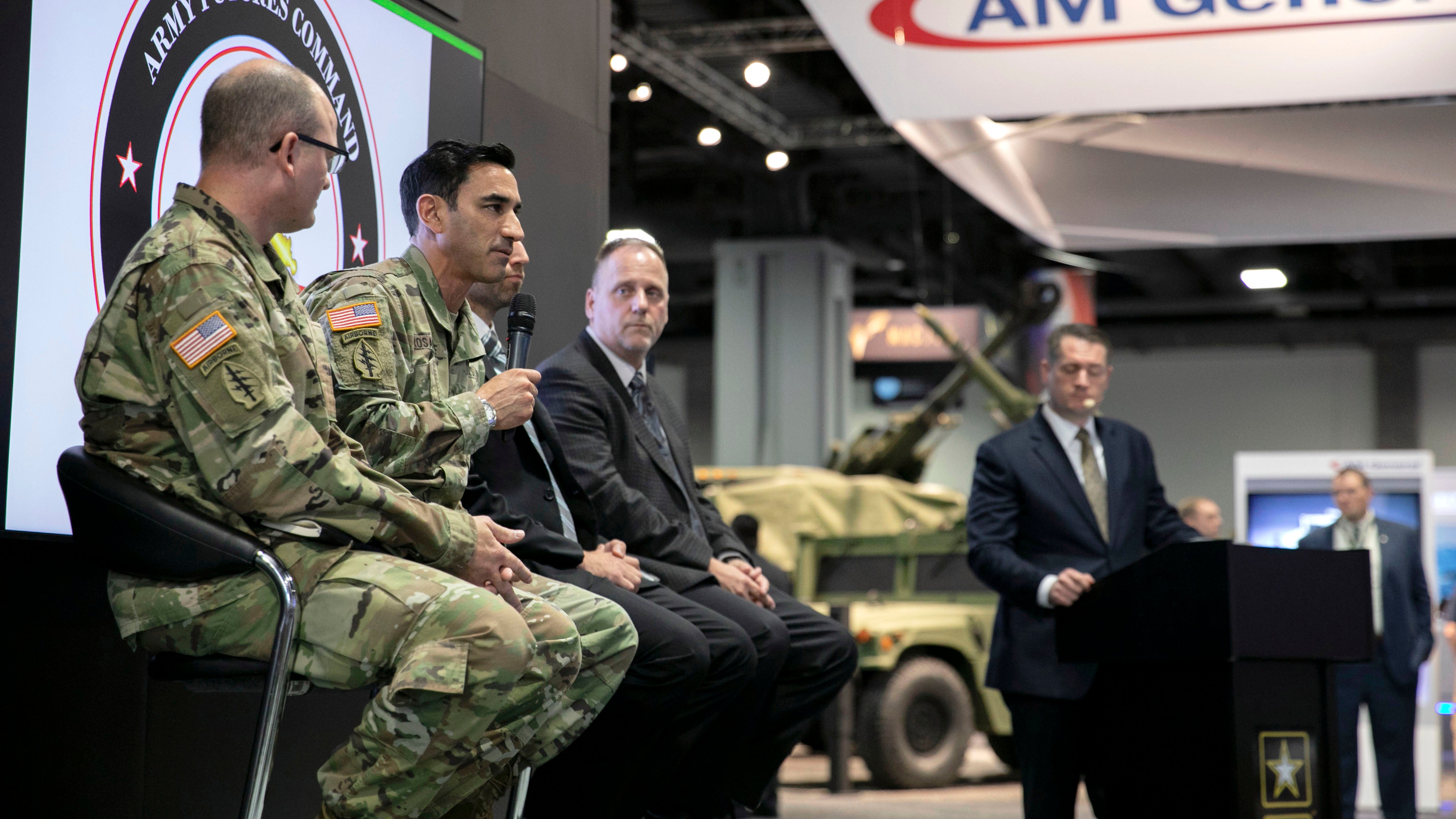 Col. Leonard Rosanoff, second from left, holding microphone, answers a question during a panel discussion at a Long-Range Precision Fires workshop at the 2019 AUSA Annual Meeting and Exposition at the Washington Convention Center on Oct. 14, 2019. 