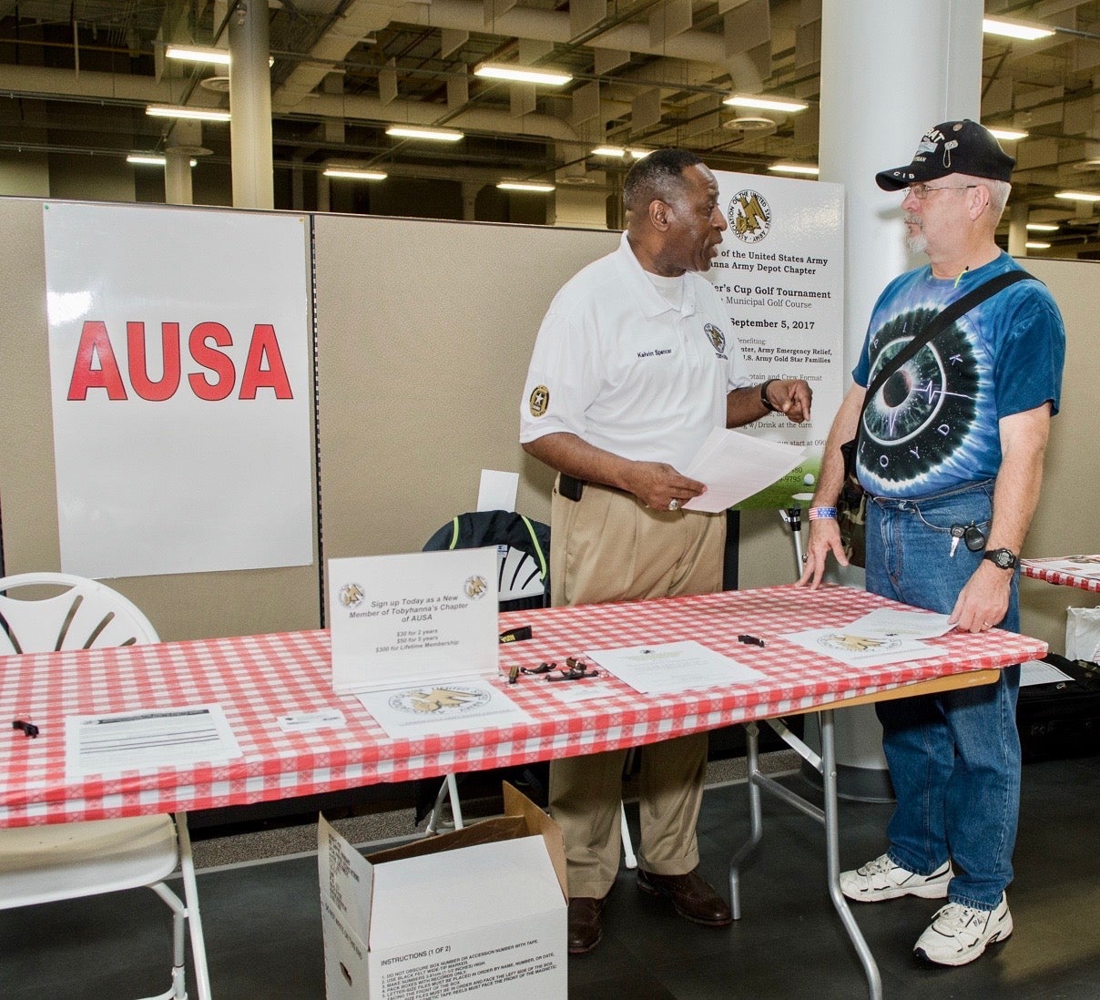 SGM Kelvin Spencer, U.S. Army Retired, signs up a new member at an AUSA membership drive
