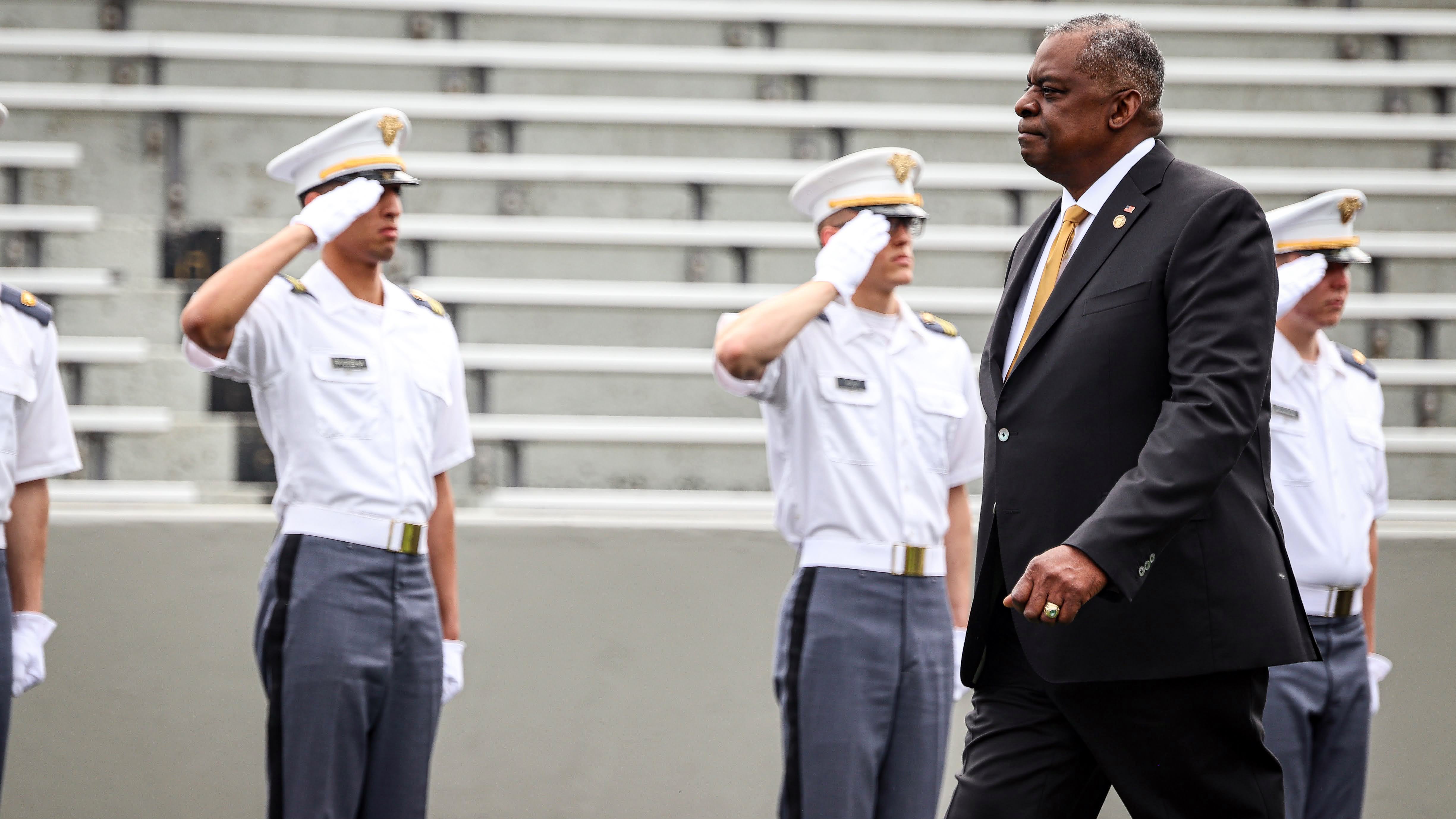 Cadets saluting Secretary of Defense