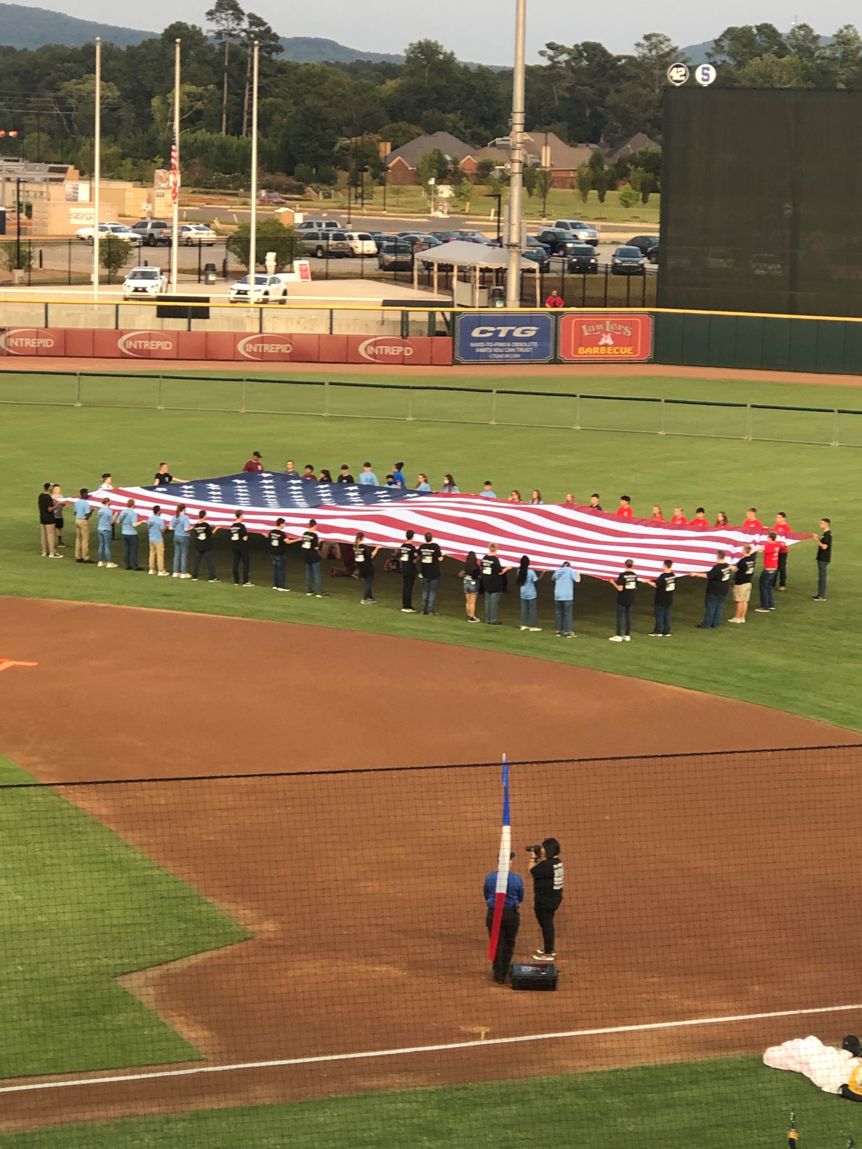 JROTC cadets with U.S. Flag during National Anthem
