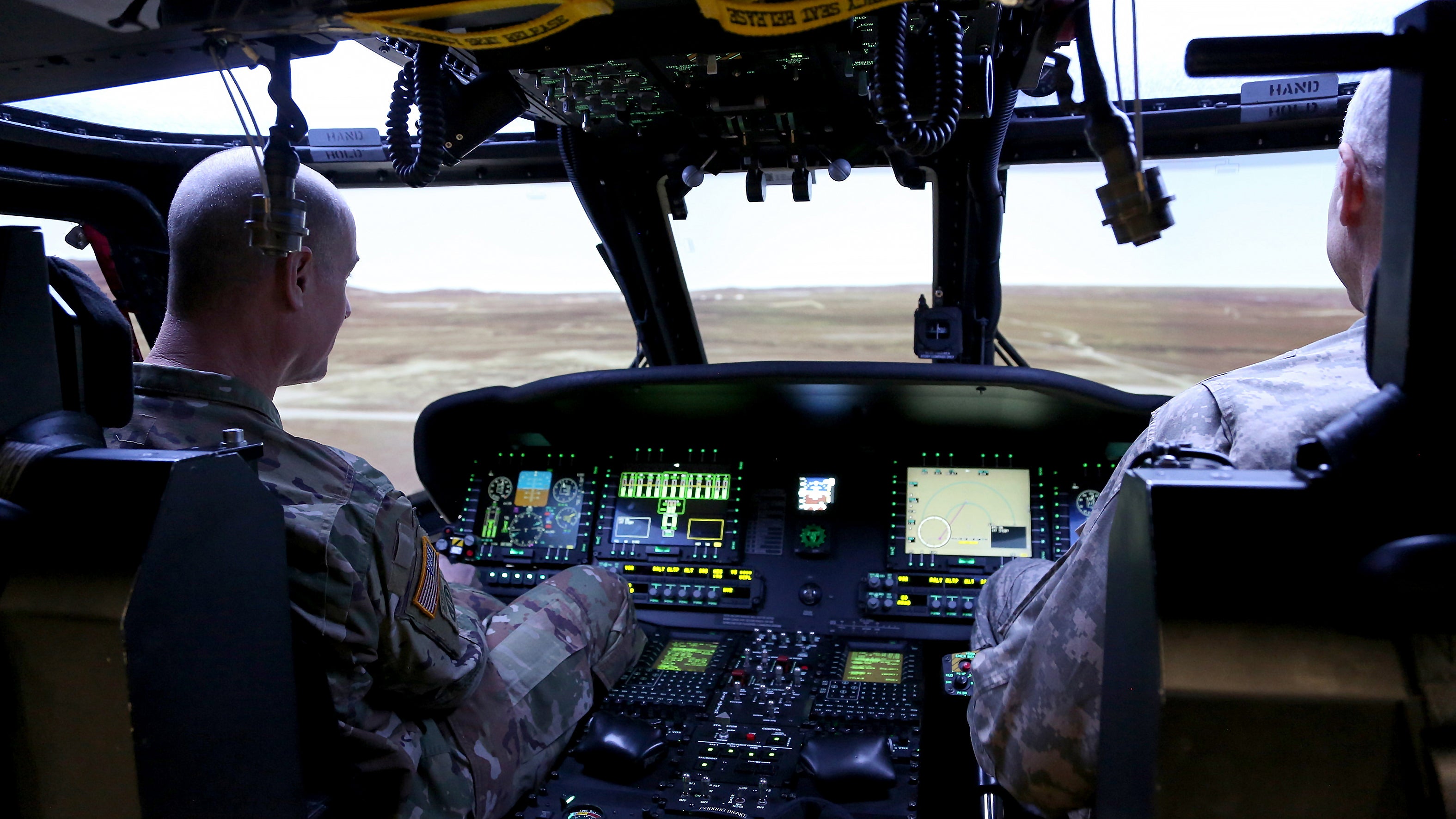 Soldiers training in virtual helicopter cockpit