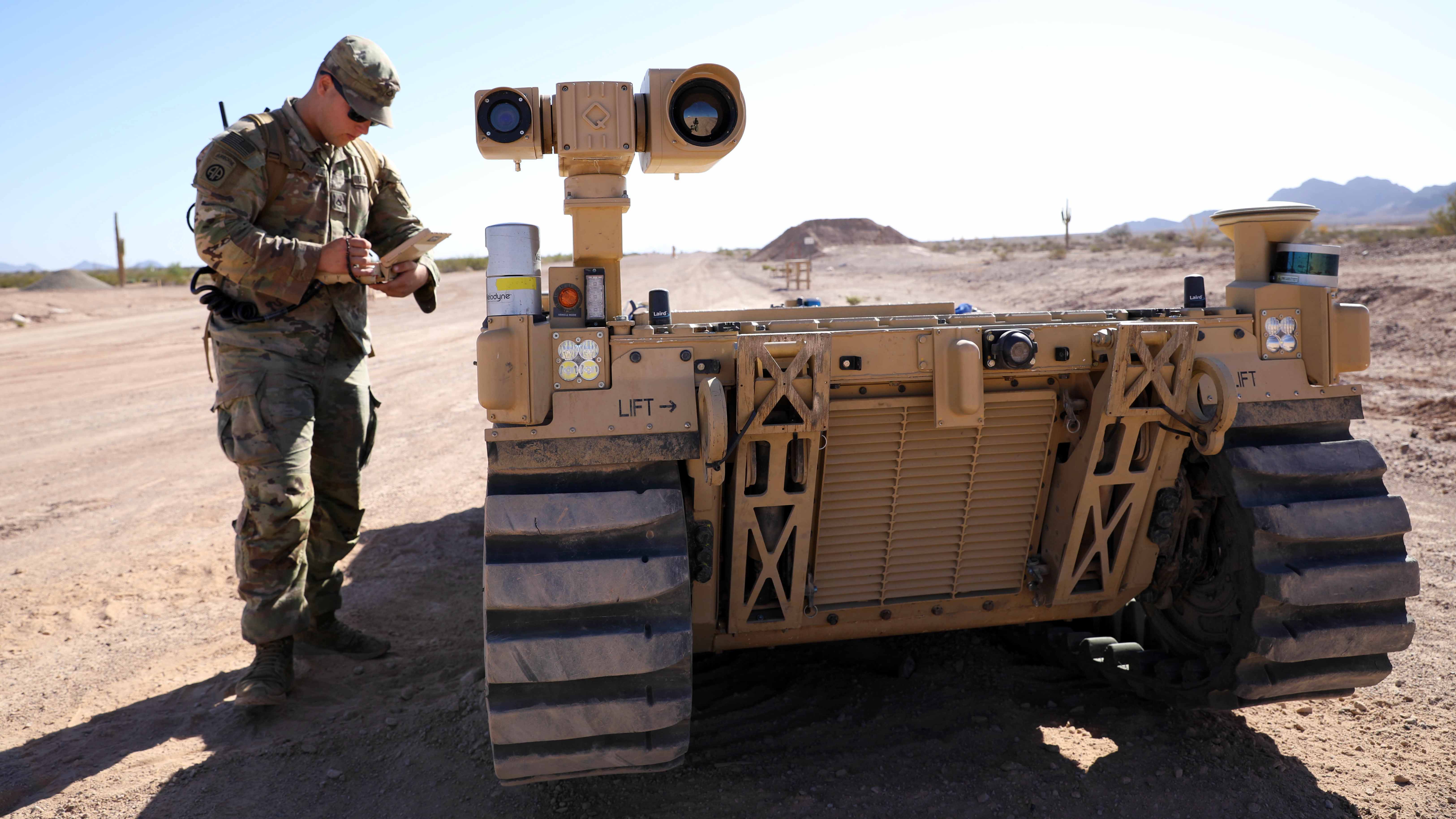 Soldier with robot vehicle