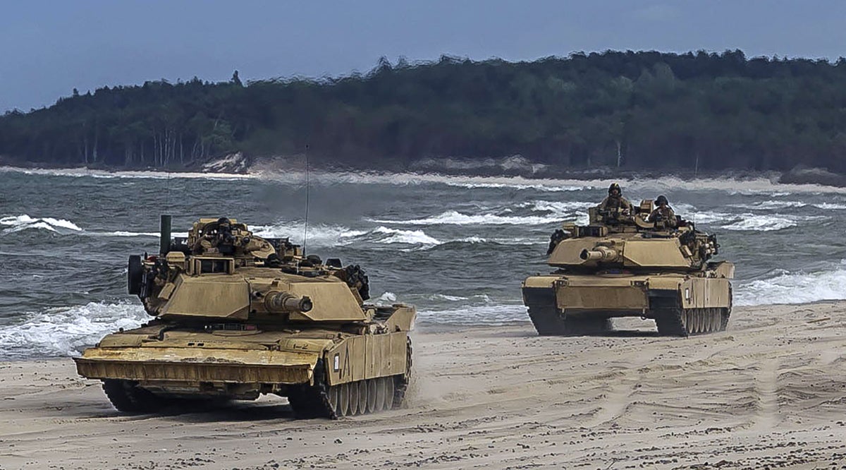 Marine M1A1 Abrams tanks on a beach
