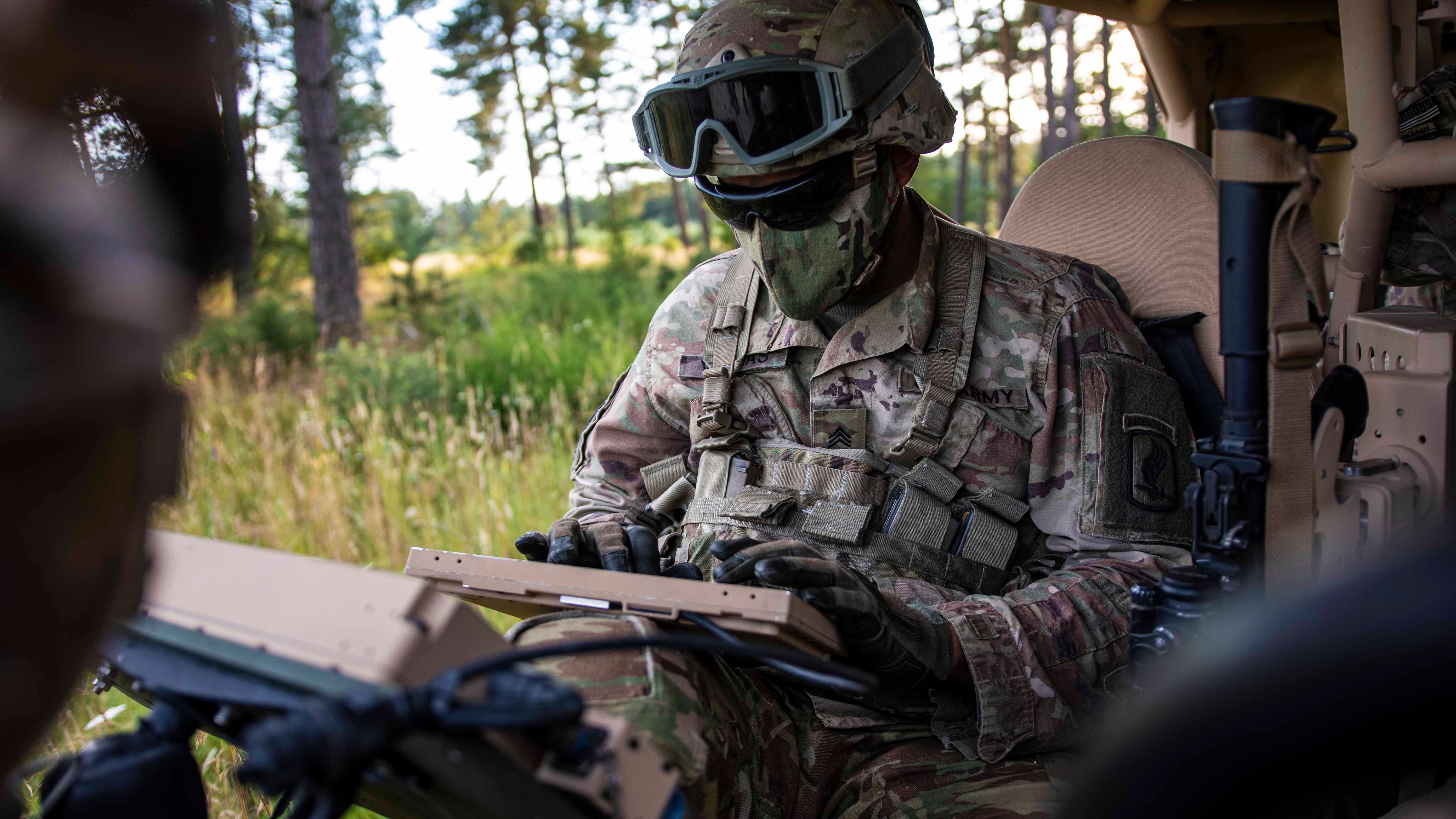Soldier on battlefield on computer