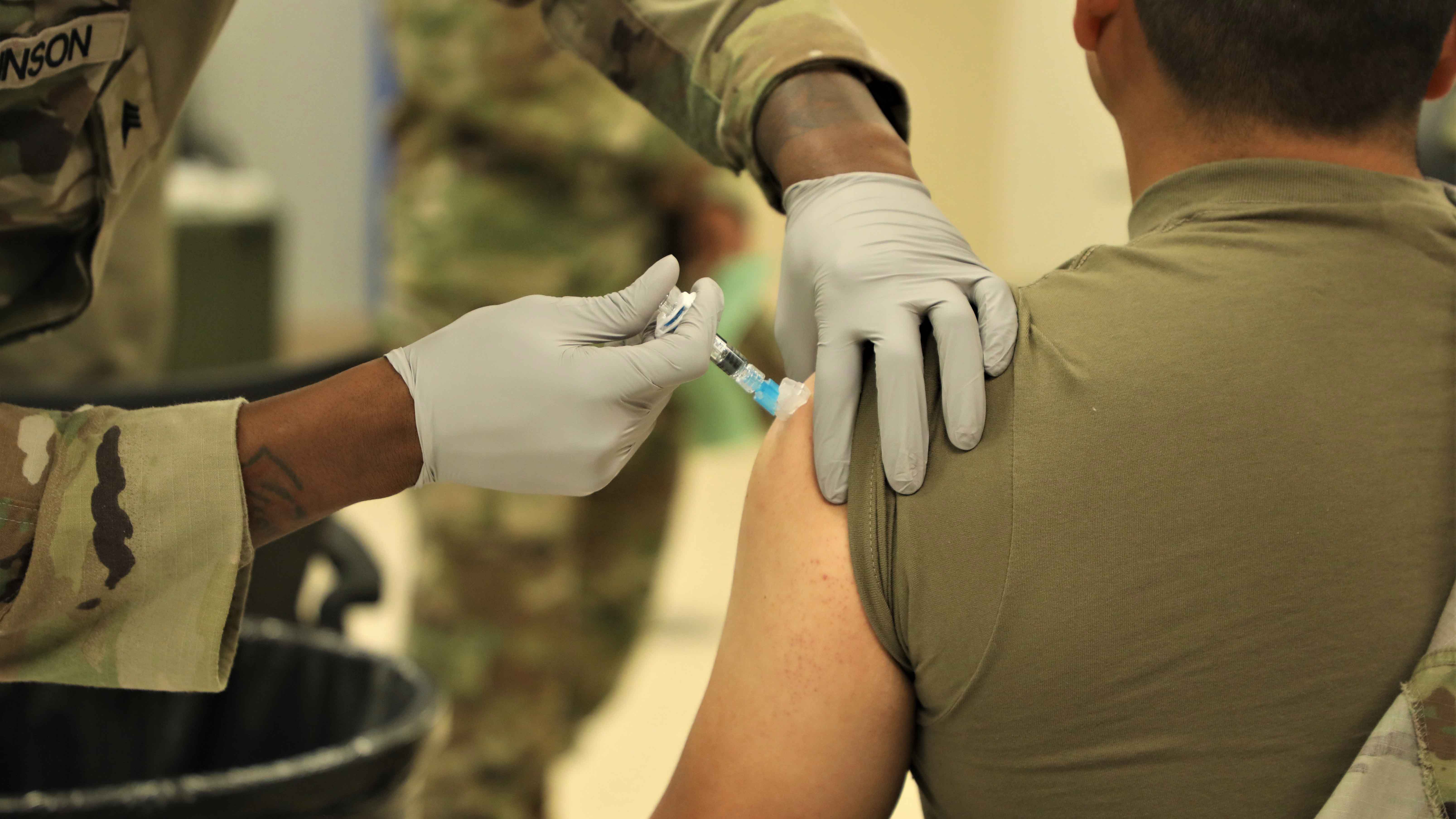 Soldier receiving vaccine