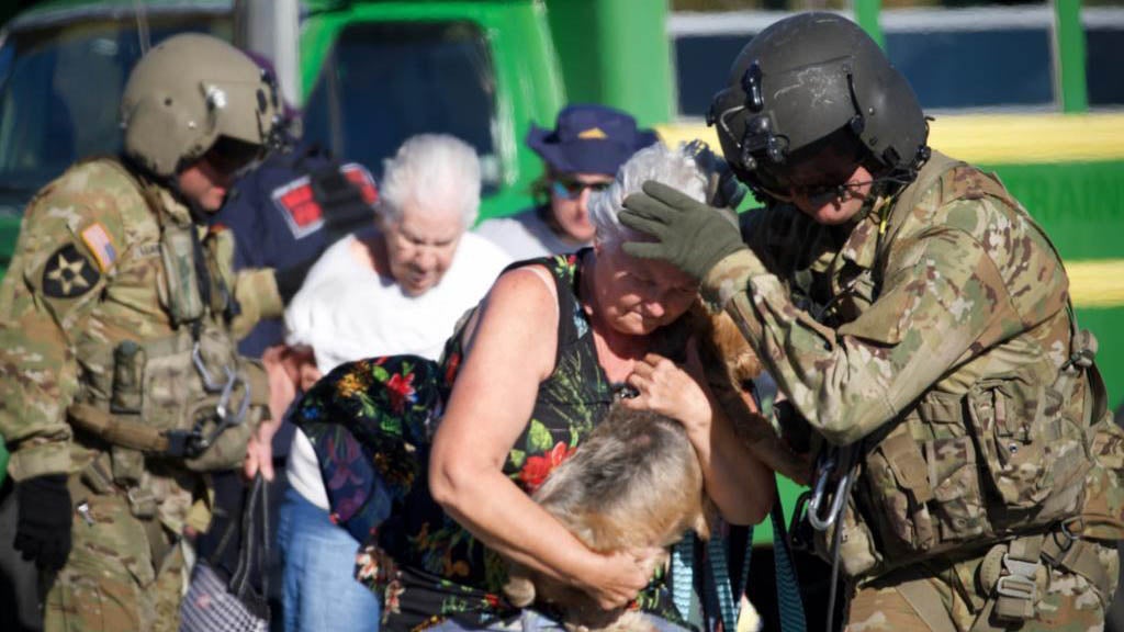 Soldier helping evacuees in a disaster