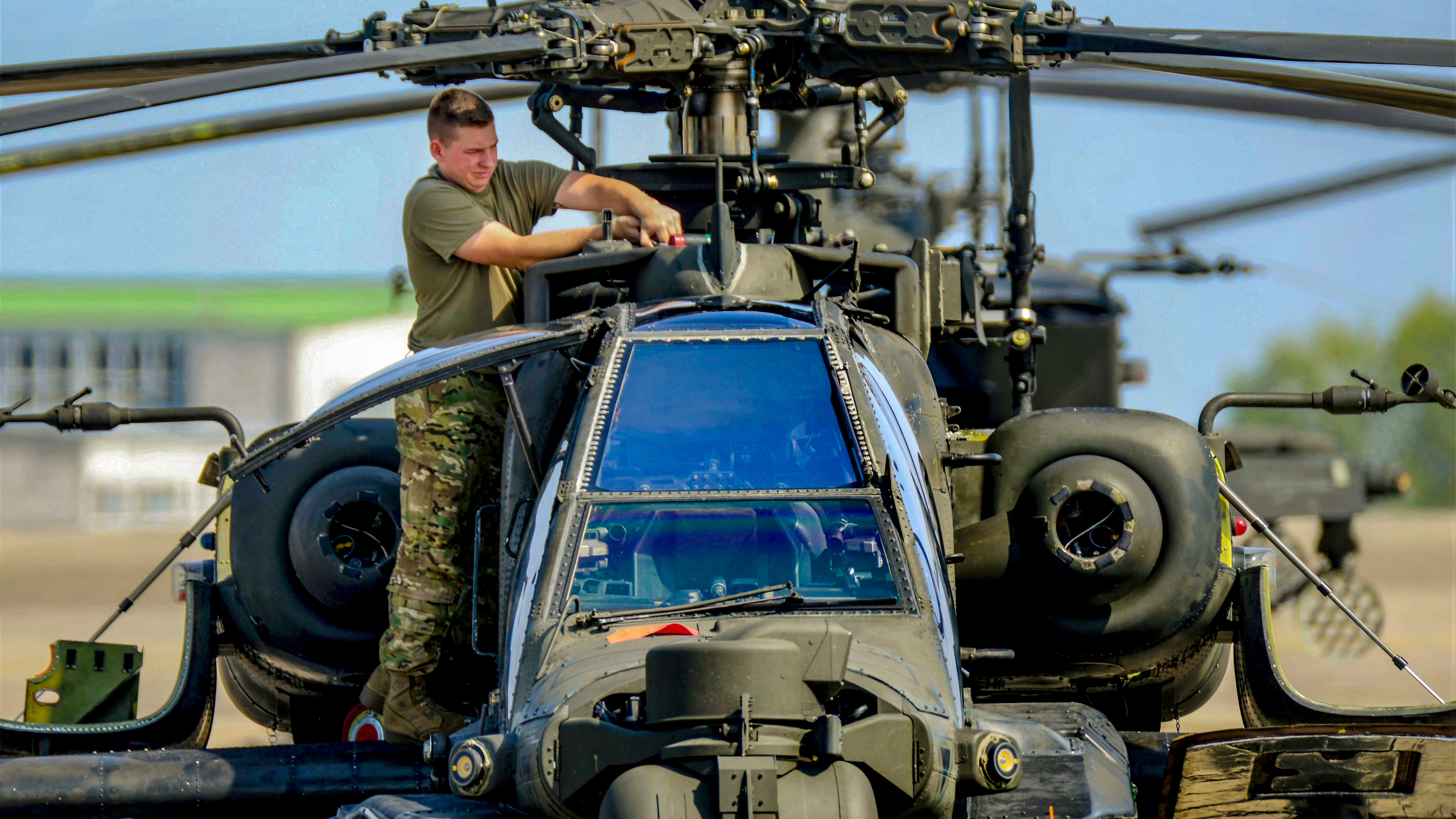 Soldier maintaining Apache 