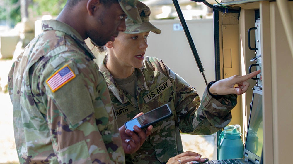 Soldiers analyzing data
