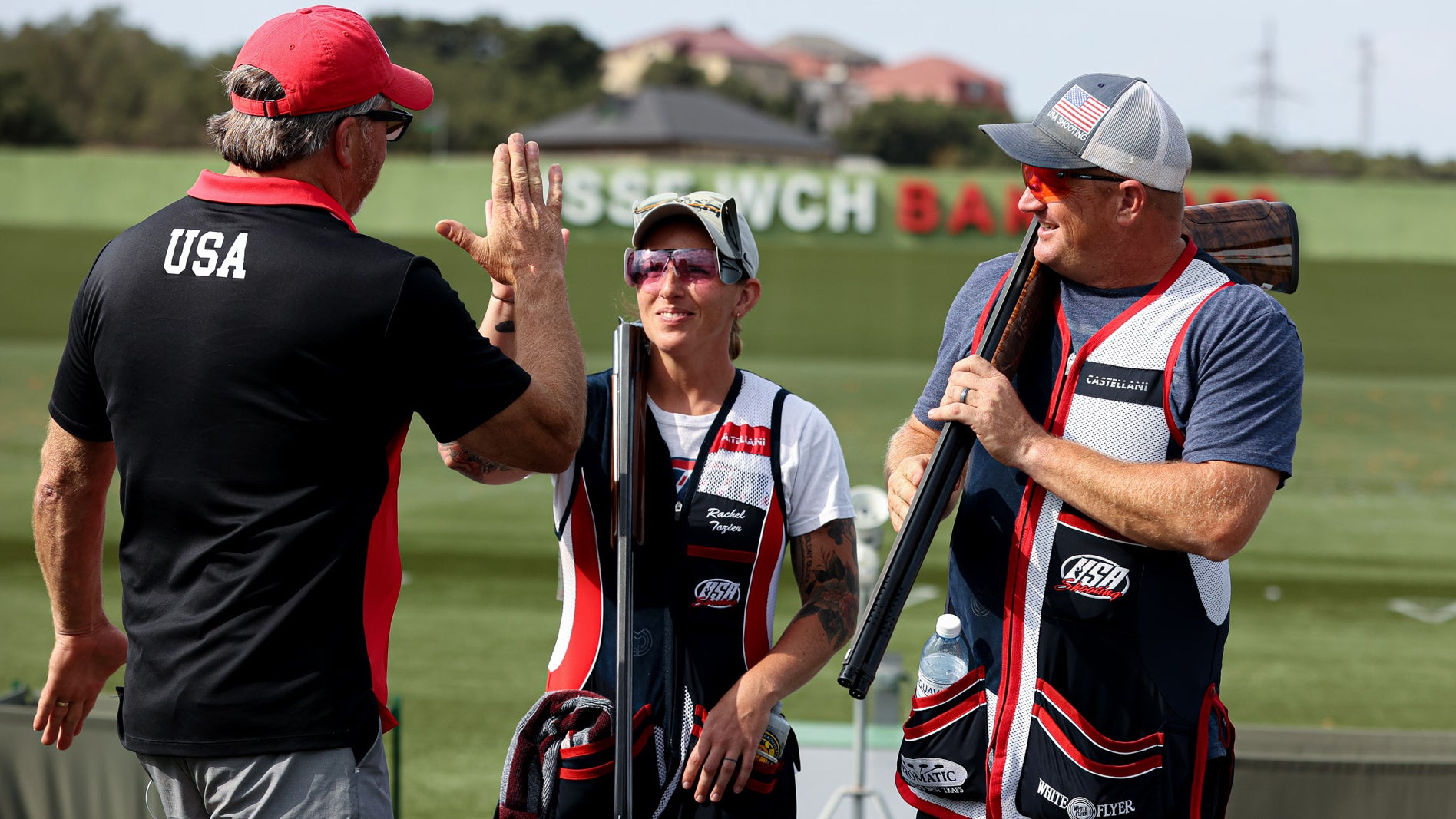 Staff Sgt. Rachel Tozier (middle) high fives her USA Shooting coach Jay Waldron at the 2023 International Shooting Sports Federation World Championship in Baku, Azerbaijan, Aug. 14 - Sept. 1. Tozier and 2020 Olympian Derrick Mein won the Silver Medal in the Mixed Trap Team event. Tozier is a marksmanship instructor/competitive shooter, with the U.S. Army Marksmanship Unit who hails from Pattonsburg, Missouri. (USA Shooting photograph by Brittany Nelson)