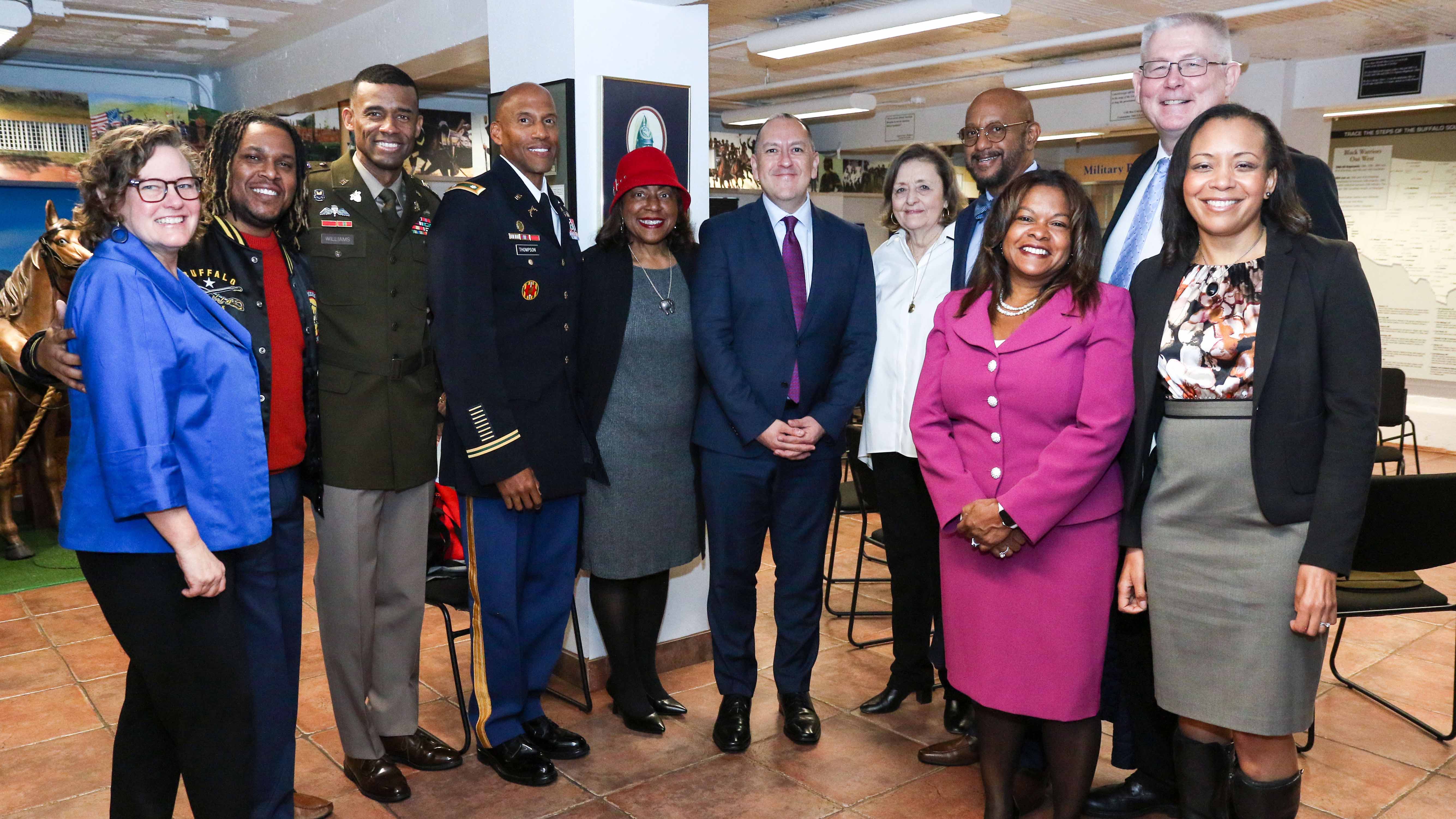 Hon. Gabe Camarillo, the Under Secretary of the Army, center, poses for a group photo with descended family members of the afflicted deceased from the 1917 Houston Riots before a ceremony at the Buffalo Soldiers Museum in downtown Houston, Texas on Nov. 13, 2023. 