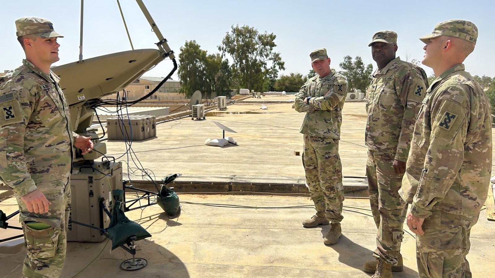 Soldiers brief the capabilities of the SIPR/NIPR Access Point antenna