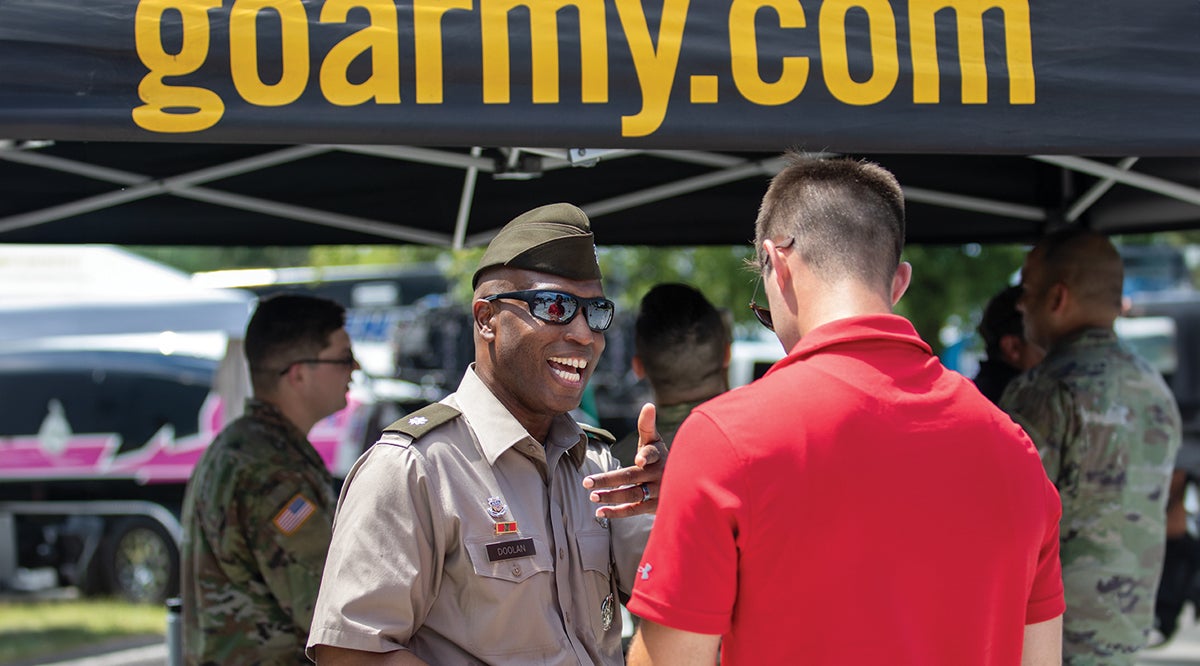 U.S. Army recruiters speaking to potential recruits