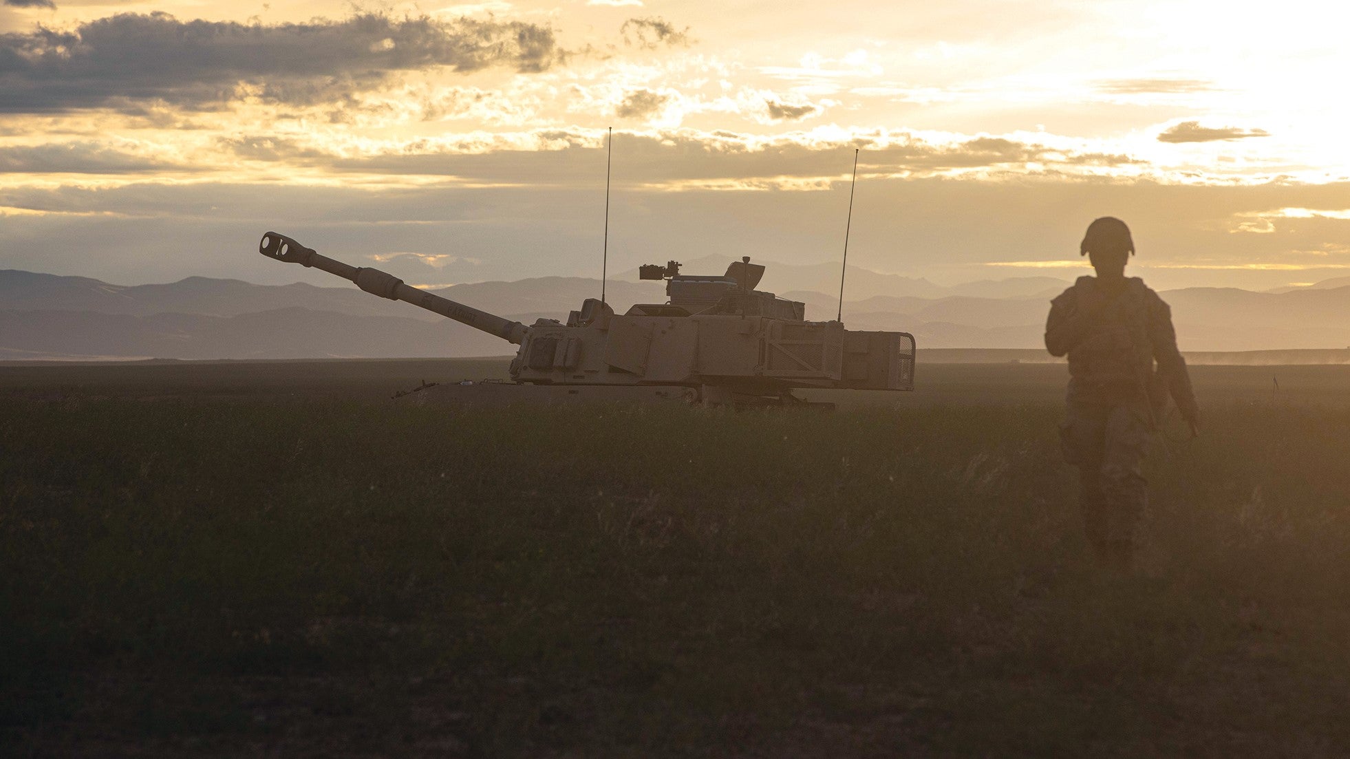Pfc. Alisi Bloomfield, the first female cannon crew member in the Utah National Guard’s Battery B, 1st Battalion, 145th Field Artillery Regiment, walks from an M109 Paladin self-propelled howitzer during an exercise at Orchard Combat Training Center, Idaho. (Credit: Army National Guard/Staff Sgt. William Cowley)