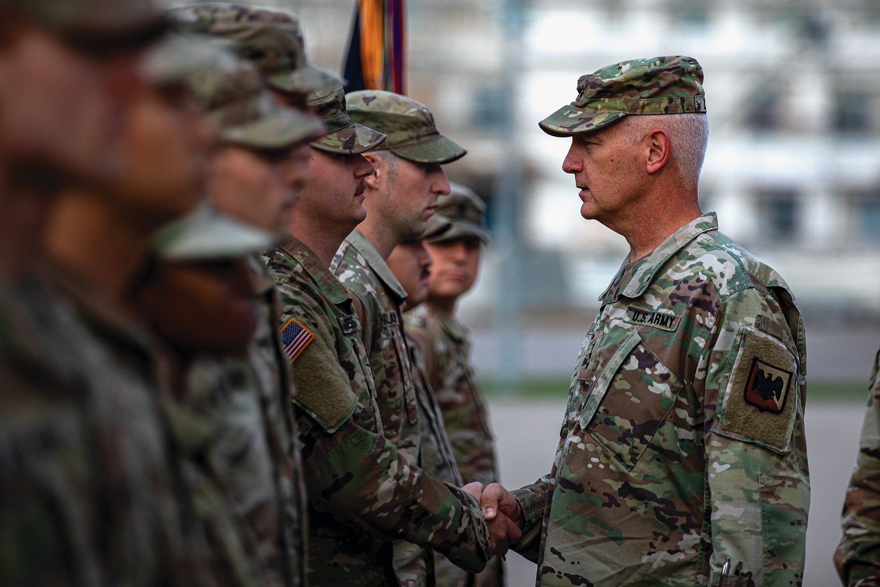 Lt. Gen. Jon Jensen, right, director of the Army National Guard, presents awards for outstanding service to soldiers with the Washington Army National Guard’s 3rd Battalion, 161st Infantry Regiment, at Bemowo Piskie Training Area, Poland. (Credit: U.S. Army/Spc. Osvaldo Fuentes)