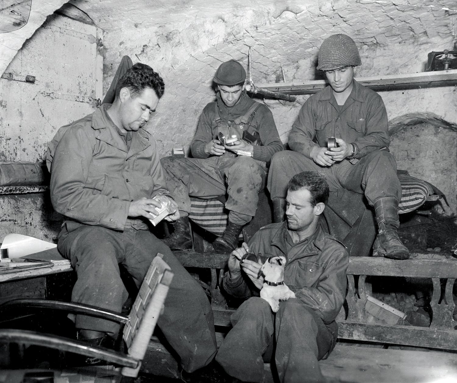 Soldiers of the 30th Infantry Division open K rations in Langendorf, Germany, in November 1944. (Credit: National Archives)