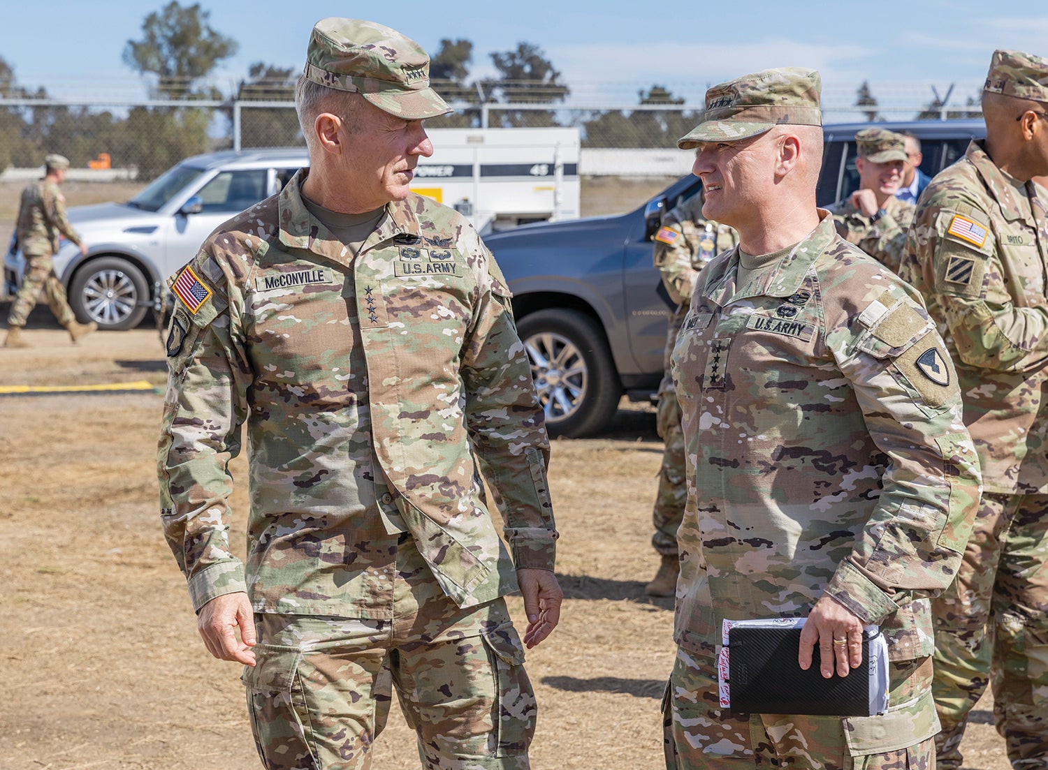 Army Chief of Staff Gen. James McConville, left, and Gen. Edward Daly, commander of the U.S. Army Materiel Command, speak during Project Convergence 2022 at Marine Corps Base Camp Pendleton, California. (Credit: U.S. Army//Sgt. 1st Class David Chapman)