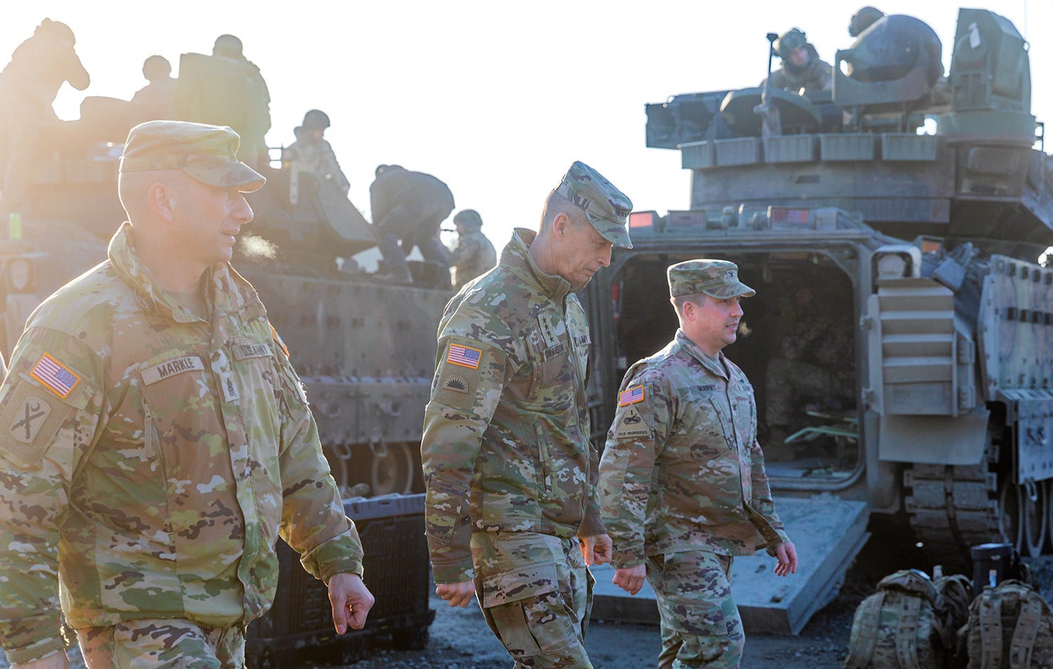 Command Sgt. Maj. Daniel Markle, left, and Col. William Murphy, right, leaders of the New York Army National Guard’s Task Force Orion, walk with Gen. Daniel Hokanson, chief of the National Guard Bureau, through a camp in Grafenwoehr, Germany. The task force staffs Joint Multinational Training Group-Ukraine. (Credit: National Guard/Staff Sgt. Jordan Sivayavirojna)