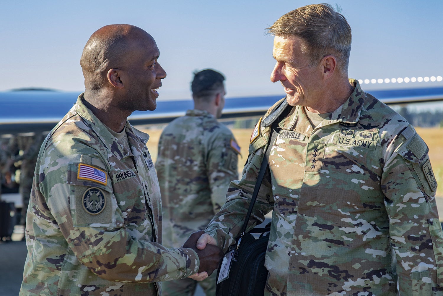 Lt. Gen. Xavier Brunson, left, commander of I Corps, greets Army Chief of Staff Gen. James McConville at Joint Base Lewis-McChord, Washington. (Credit: U.S. Army/Spc. Richard Carlisi)