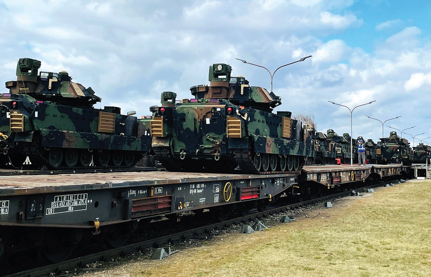  Above: Bradley Fighting Vehicles are loaded onto rail cars in Mannheim, Germany. (Credit: U.S. Army/Cameron Porter)