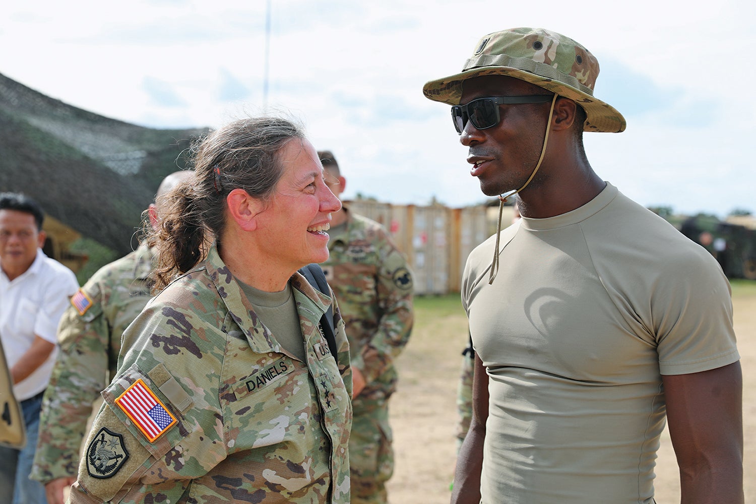Lt. Gen. Jody Daniels, left, chief of the U.S. Army Reserve and commanding general of the U.S. Army Reserve Command, speaks with 1st Lt. Amos Lamah of the 3rd Battalion, 25th Aviation Regiment, during a bilateral exercise in Lop Buri, Thailand. (Credit: U.S. Army/Sgt. 1st Class Joseph VonNida)