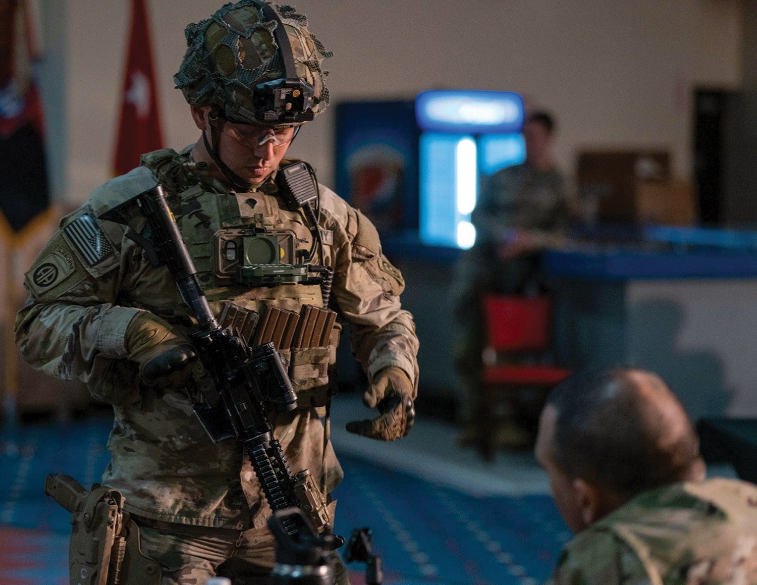 A paratrooper from the 82nd Airborne Division demonstrates a flip-down keypad display unit during the division’s first Innovation Drop Zone Competition at Fort Bragg, now Fort Liberty, North Carolina. (Credit: U.S. Army/ Sgt. Robert Whitlow)
