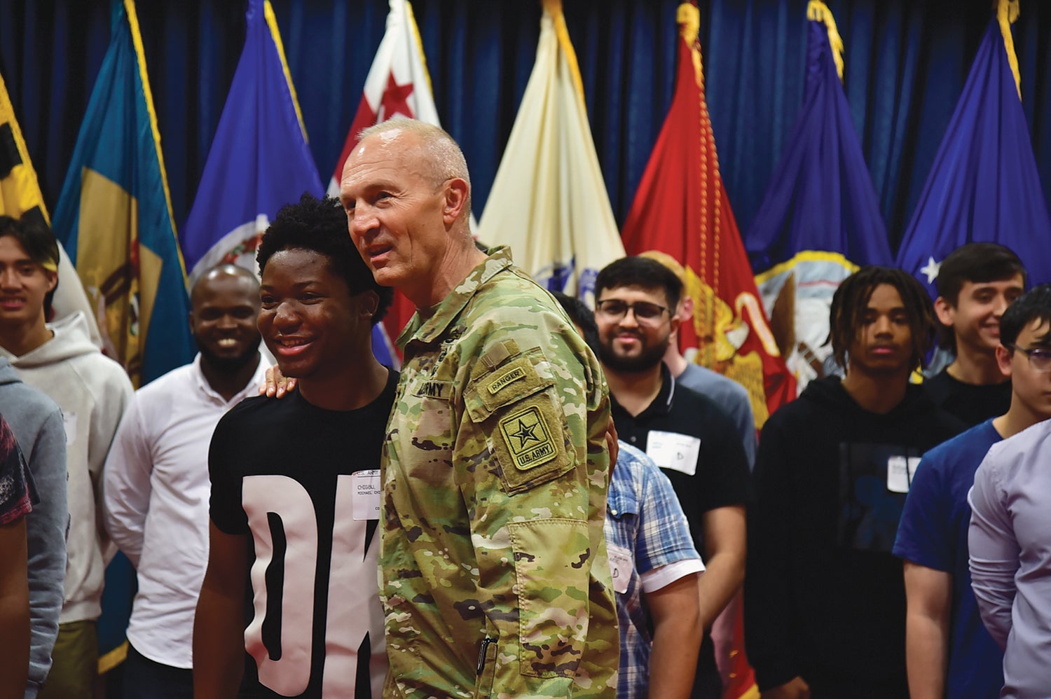 Army Vice Chief of Staff Gen. Randy George chats with a young enlistee during an enlistment event with 20 military recruits at Fort Meade, Maryland. (Credit: U.S. Army/Gloriann Martin)