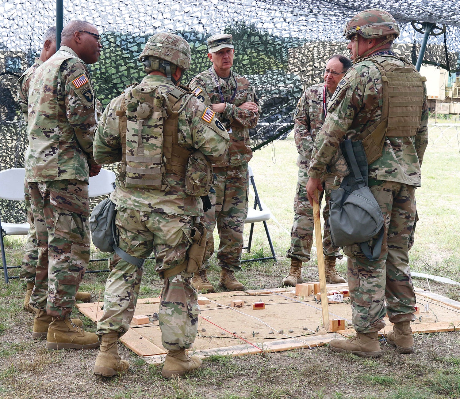 Army National Guard Director Lt. Gen. Jon Jensen, in cap, meets with Guard soldiers at Camp Grayling Joint Maneuver Training Center, Michigan. (Credit: Michigan National Guard)