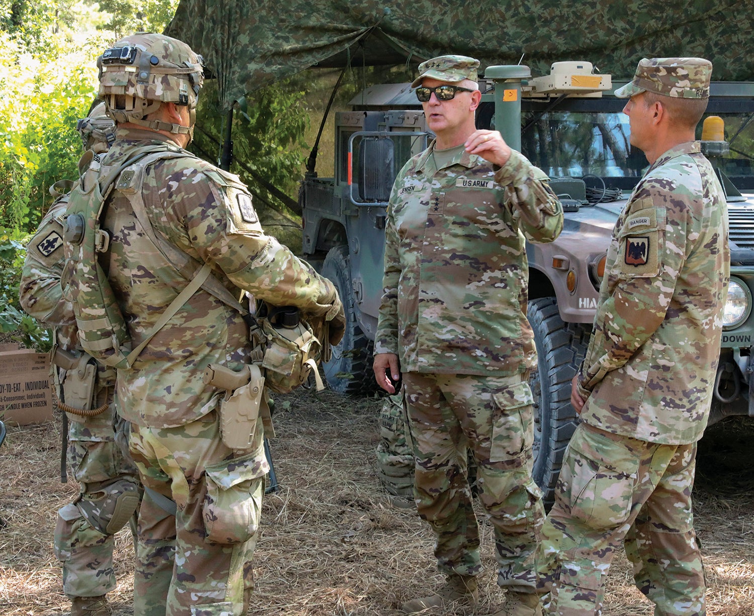 Lt. Gen. Jon Jensen, second from right, and Command Sgt. Maj. John Raines, right, Army National Guard director and senior enlisted leader, respectively, meet with leaders of the Hawaii Army National Guard’s 29th Infantry Brigade Combat Team during training at Fort Johnson, Louisiana, formerly known as Fort Polk. (Credit: Army National Guard/Spc. Sean Walker)