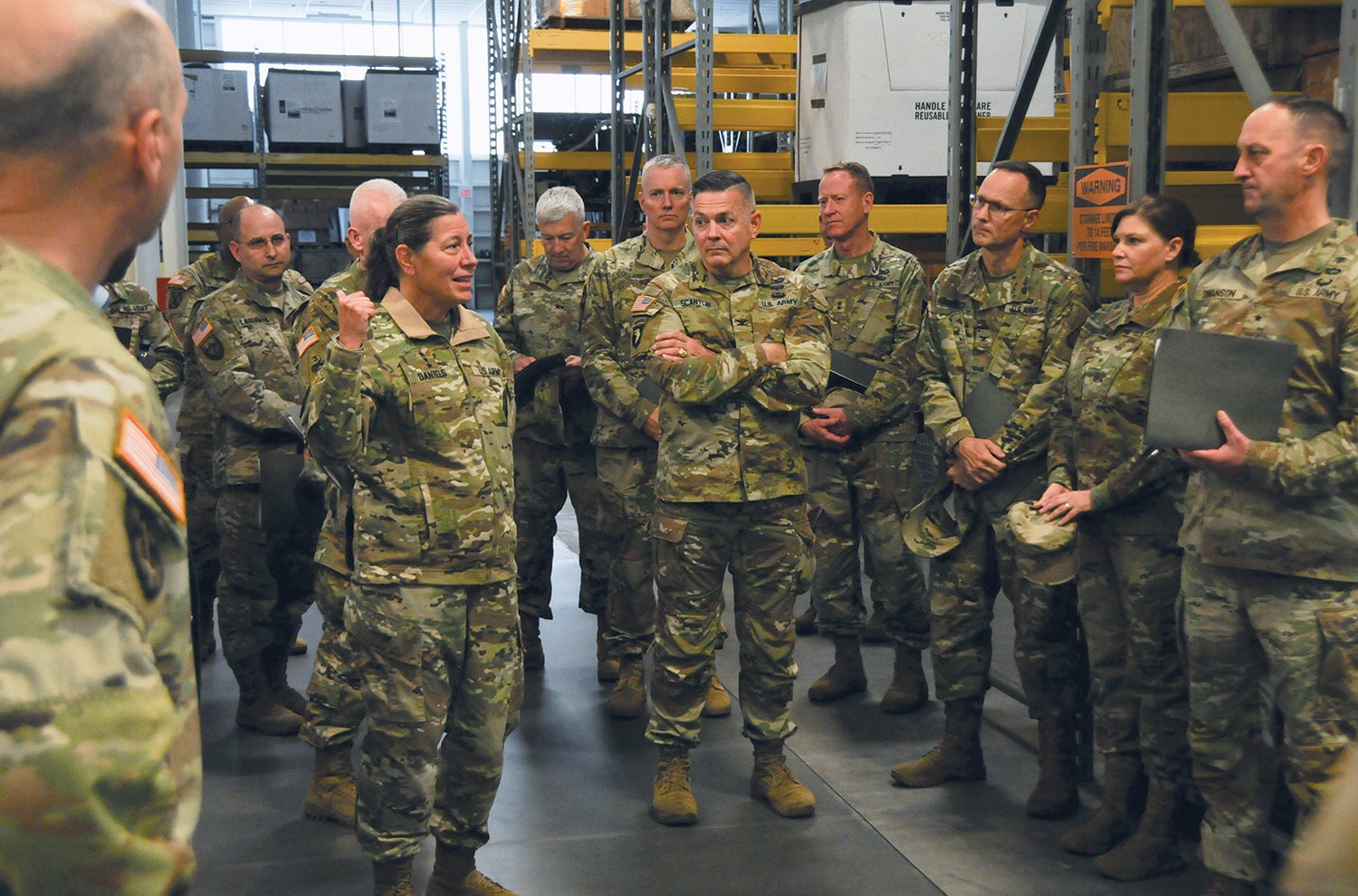 Lt. Gen. Jody Daniels, left, chief of the U.S. Army Reserve and commanding general of the U.S. Army Reserve Command, leads Army Reserve senior leaders on a tour of a 99th Readiness Division equipment and vehicle maintenance and storage site at Joint Base McGuire-Dix-Lakehurst, New Jersey. (Credit: U.S. Army/Shawn Morris)