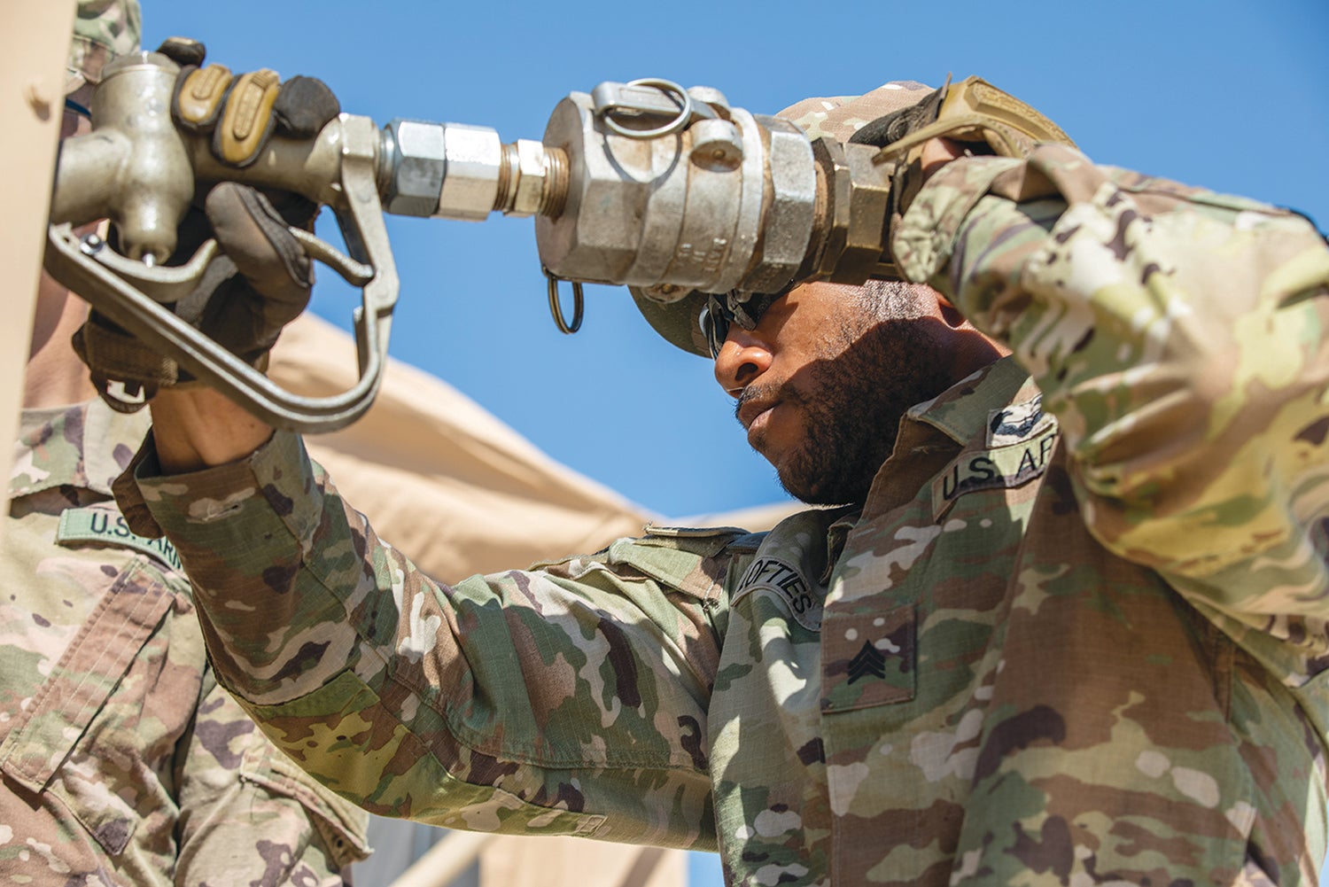 Sgt. Jermey Lofties, of the Tennessee National Guard’s 730th Quartermaster Company, operates a pump before a convoy exercise in Jordan. (Credit: Army National Guard/Sgt. Ryan Scribner)