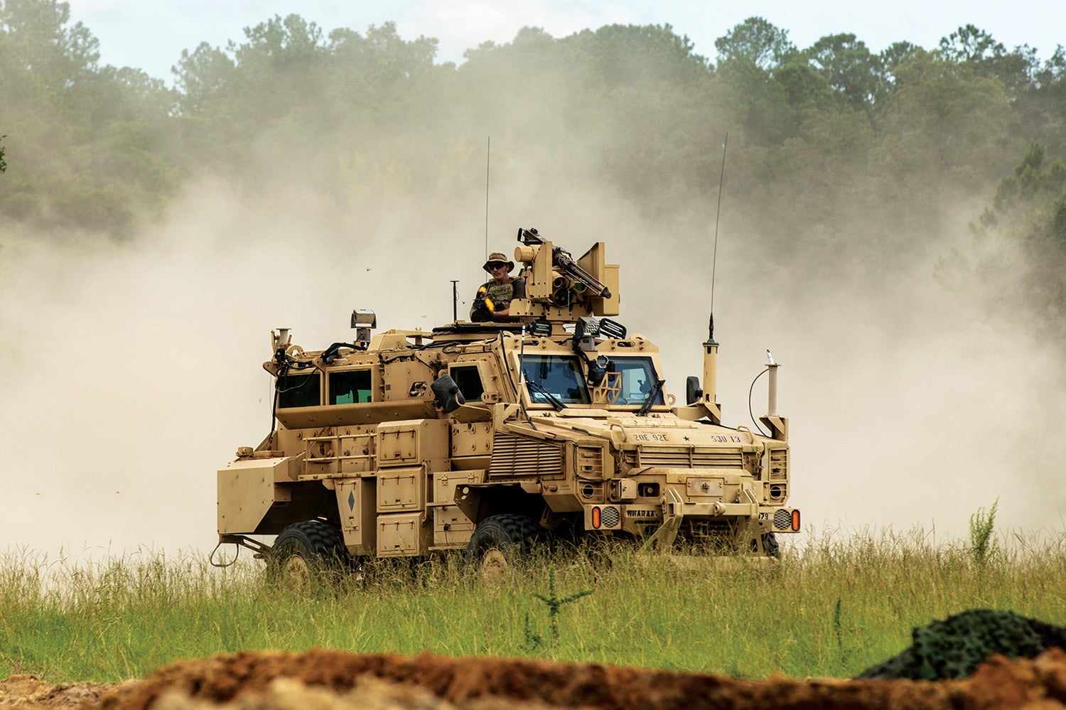 A soldier with the 92nd Engineer Battalion fires from an MRAP during a validation exercise at Fort Stewart, Georgia. (Credit: U.S. Army/Sgt. William Griffen)