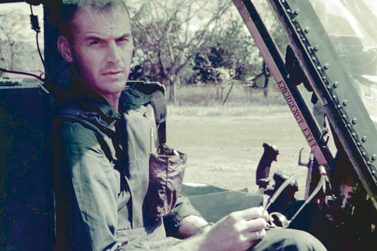 Then-1st Lt. Larry Taylor in a UH-1 ‘Huey’ helicopter in Vietnam. (Credit: Courtesy of Lewis Ray)