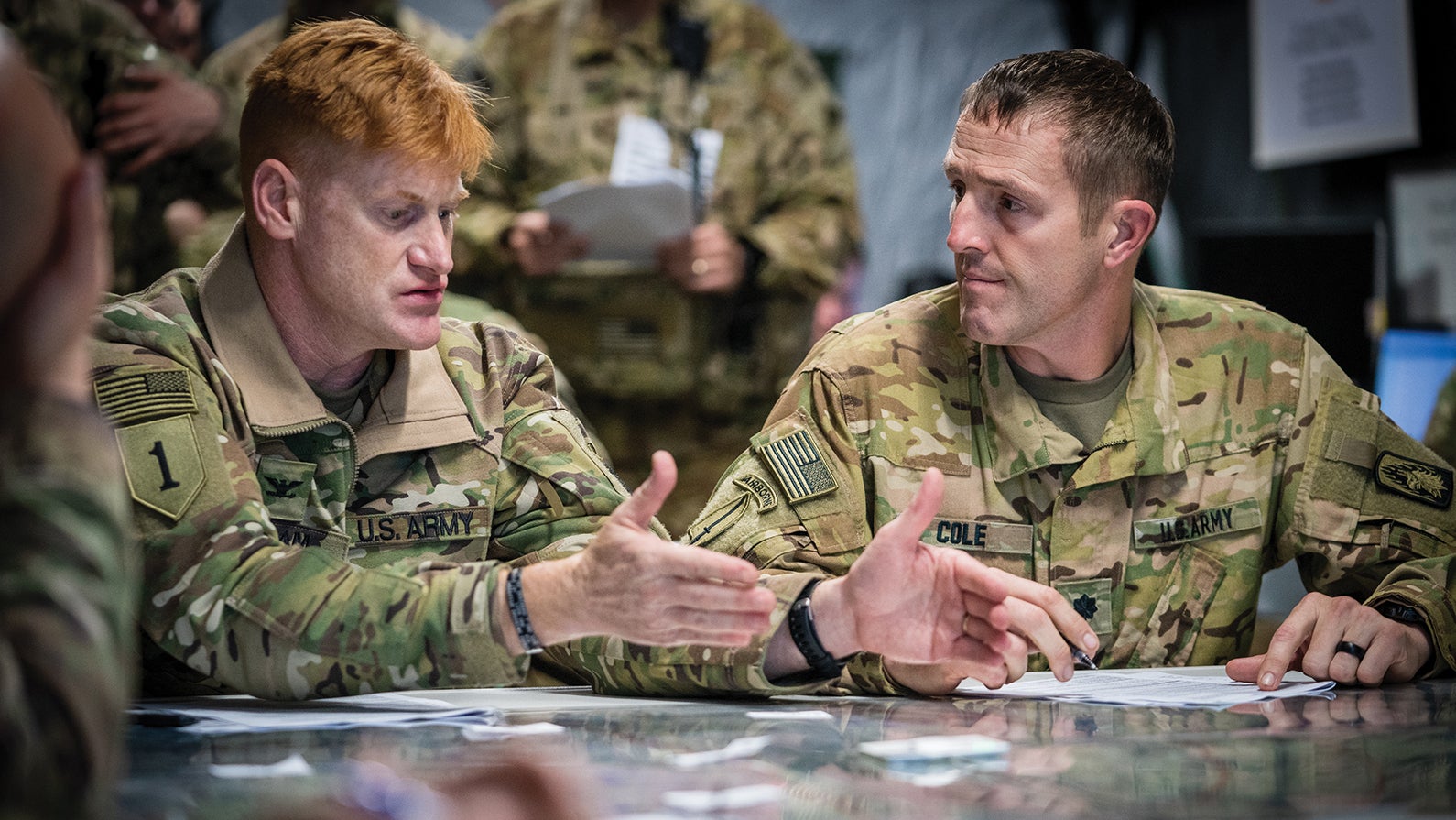 Officers with the 12th Combat Aviation Brigade confer before an exercise at Hohenfels Training Area, Germany. (Credit: U.S. Army/Maj. Robert Fellingham)