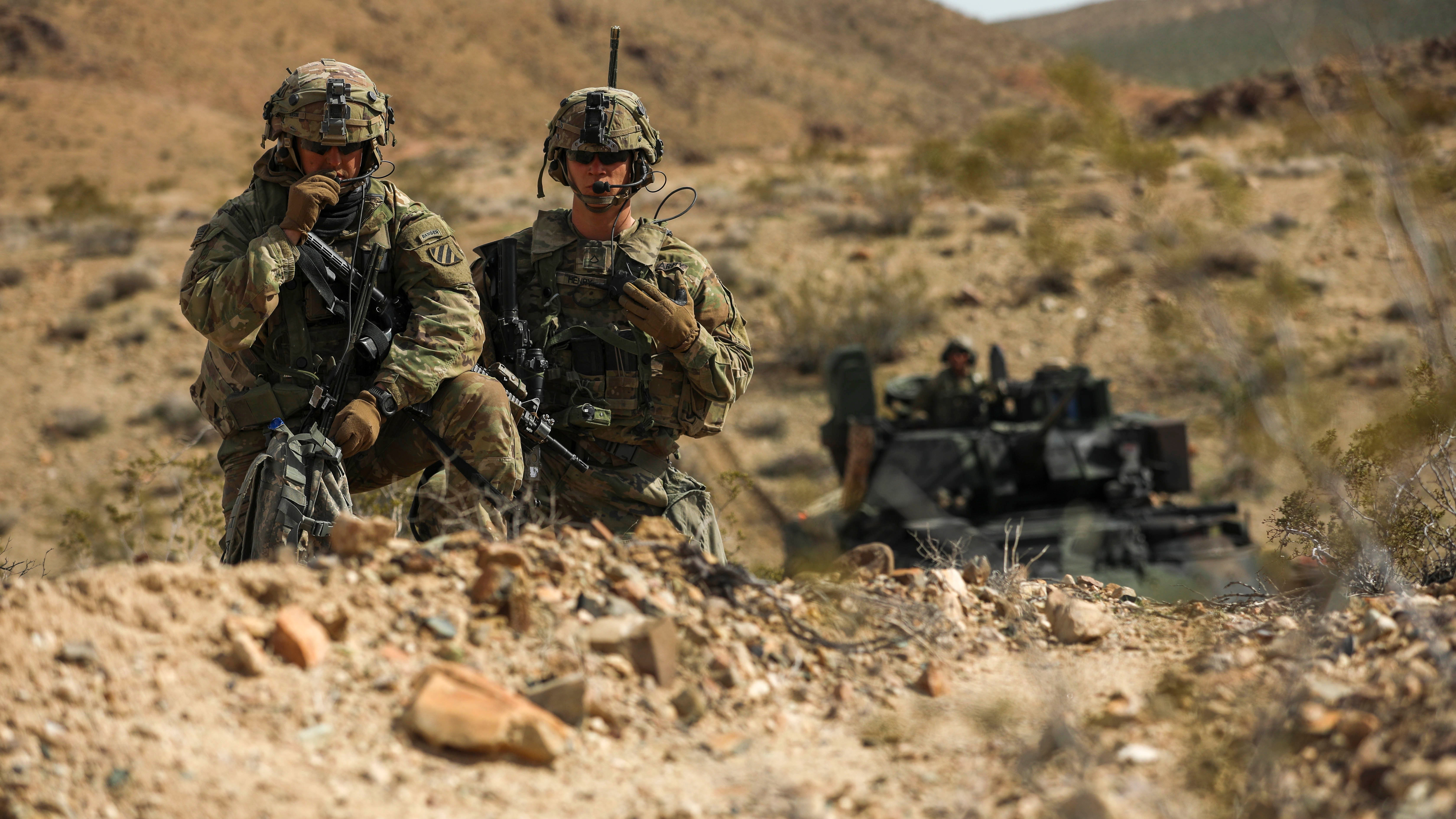Soldiers assigned to the 3rd Infantry Division’s 2nd Armored Brigade Combat Team communicate and observe the battlefield during a live-fire exercise at the National Training Center, Fort Irwin, California. (Credit: U.S. Army/Spc. Duke Edwards)