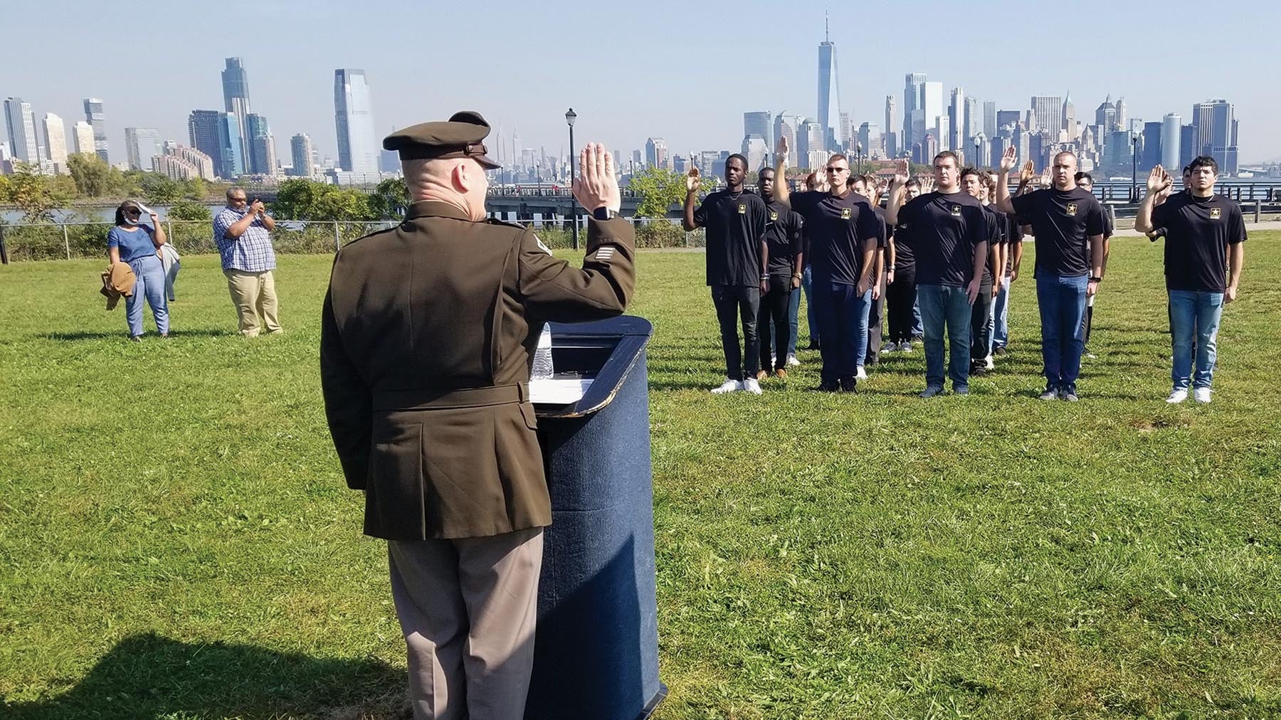 Gen. Ed Daly, commander of the U.S. Army Materiel Command, conducts a Future Soldier Swear-In Ceremony for 26 Army recruits at Liberty State Park, New Jersey, with the New York City skyline as a backdrop.