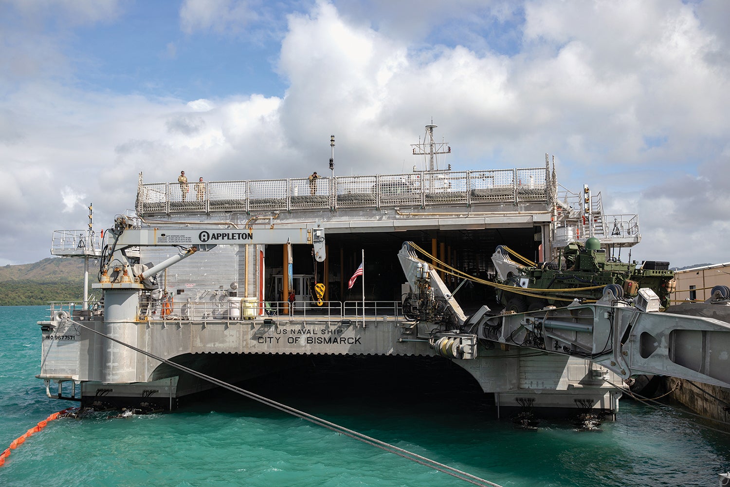 A Stryker combat vehicle is loaded onto the USNS City of Bismarck at Naval Base Guam. (Credit: U.S. Army/Spc. Jailene Bautista)