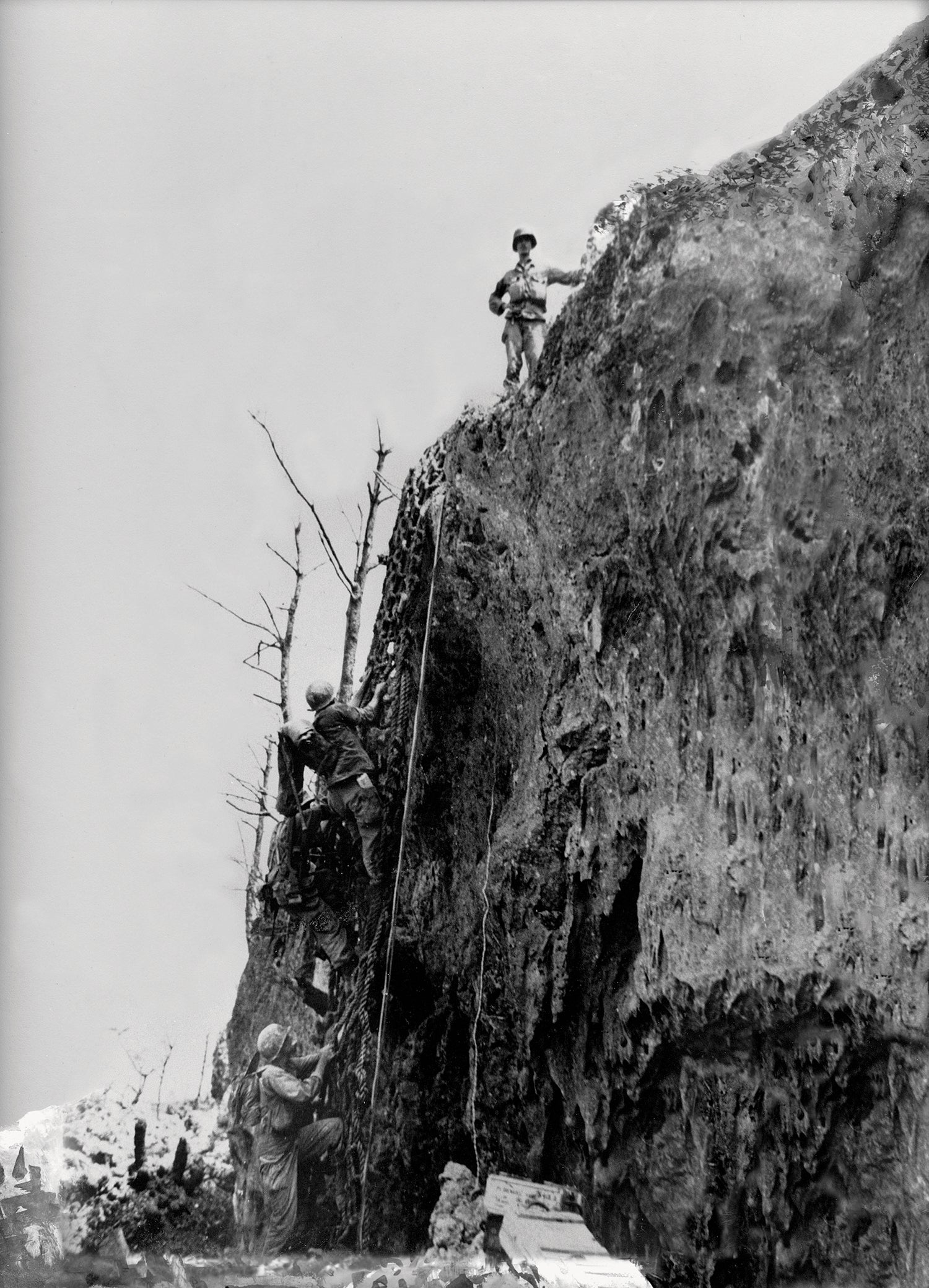 Then-Pfc. Doss stands atop Okinawa’s Maeda Escarpment on May 4, 1945, where he is credited with helping save the lives of up to 100 U.S. troops. (Credit: Wikipedia)
