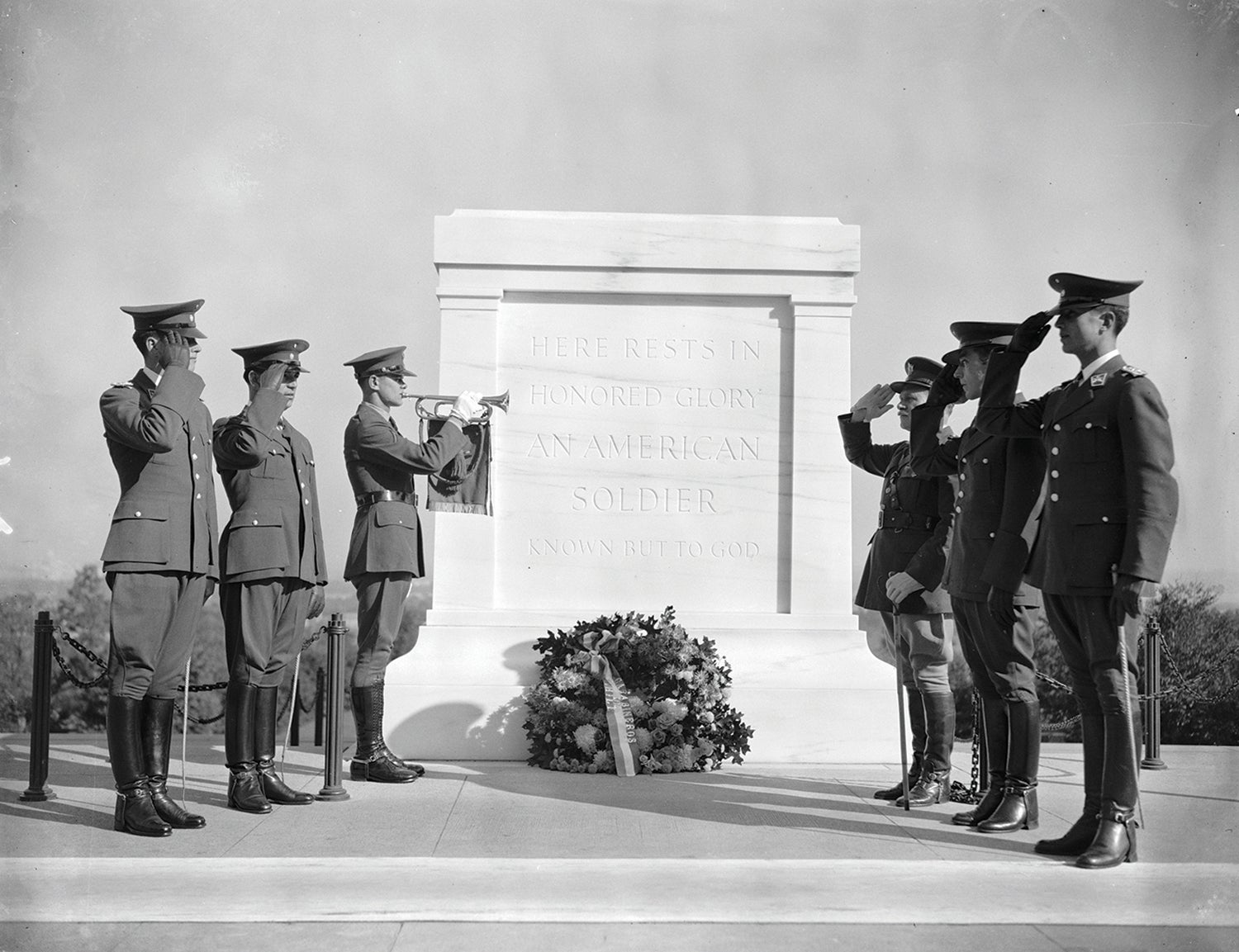 Soldiers salute at tomb