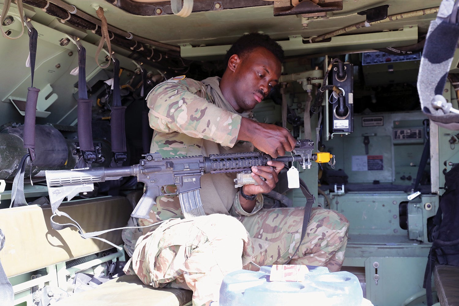 Soldier checks equipment