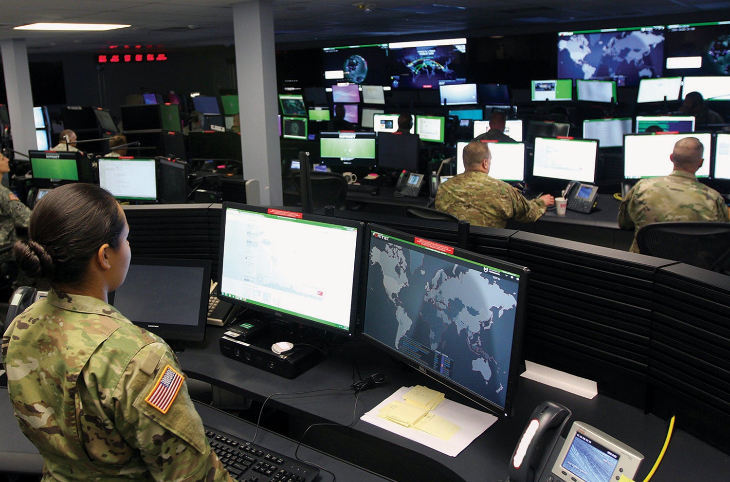 A soldier with the 780th Military Intelligence Brigade (Cyber) watches over the Joint Mission Operations Center, Fort Meade, Maryland. (Credit: U.S. Army/Steven Stover)