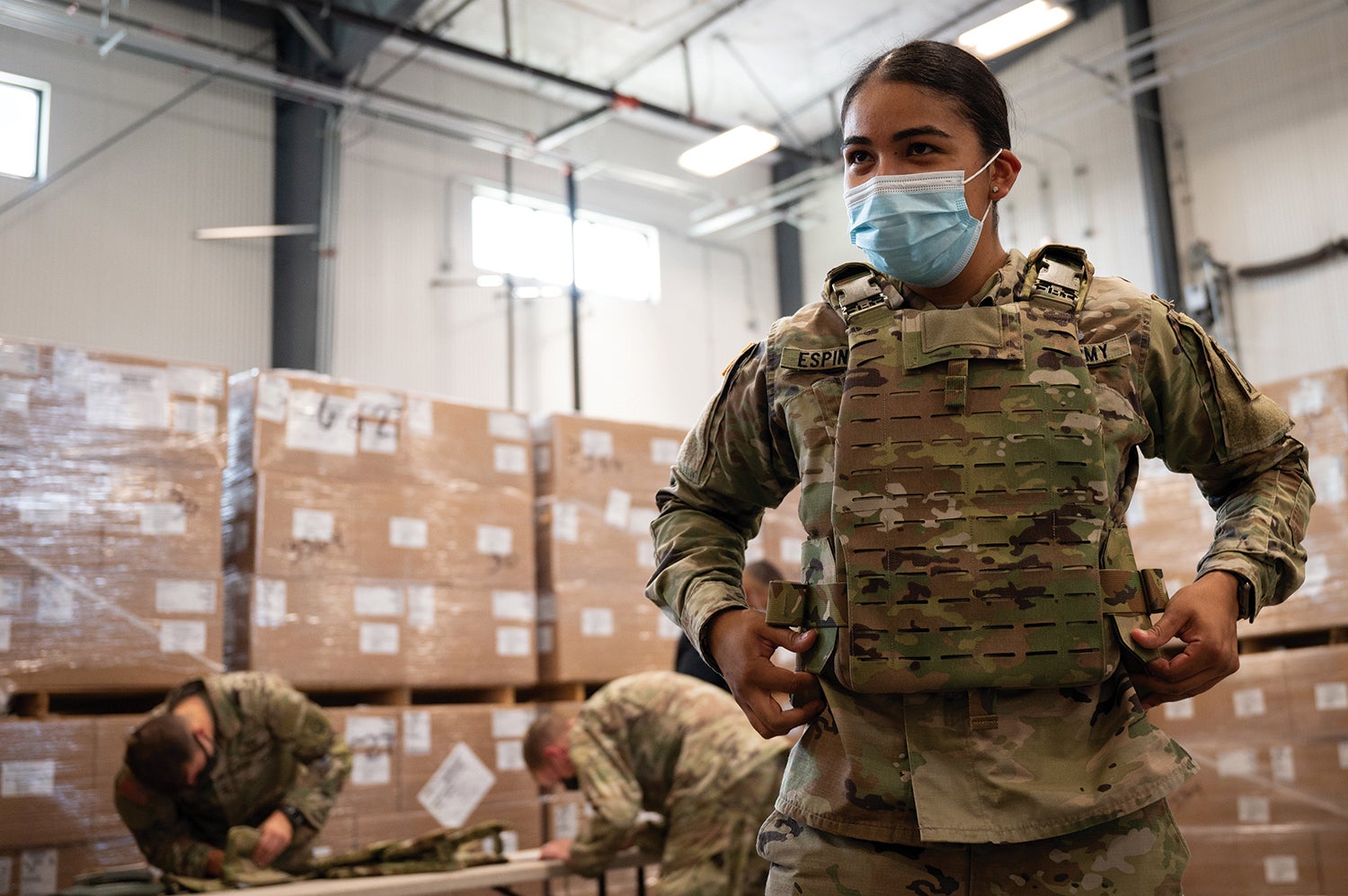 Pfc. Kimberly Espinoza with the 82nd Airborne Division adjusts her second-generation Modular Scalable Vest at Fort Bragg, North Carolina. (Credit: U.S. Army/Jason Amadi)