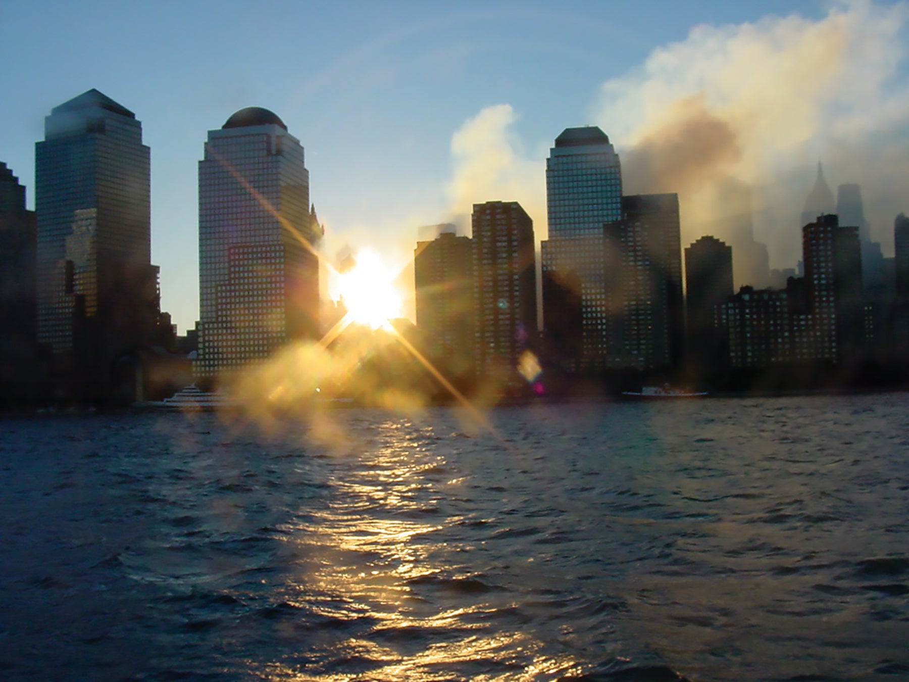Smoke can still be seen from across the Hudson River on the morning of Sept. 12, 2001, as the rubble that was New York City’s World Trade Center continues to smolder.